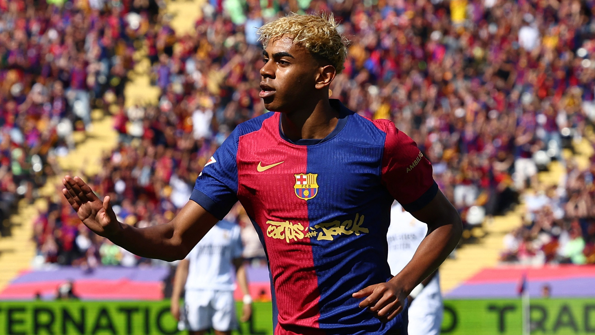 Lamine Yamal celebrating a goal with Barcelona squad.