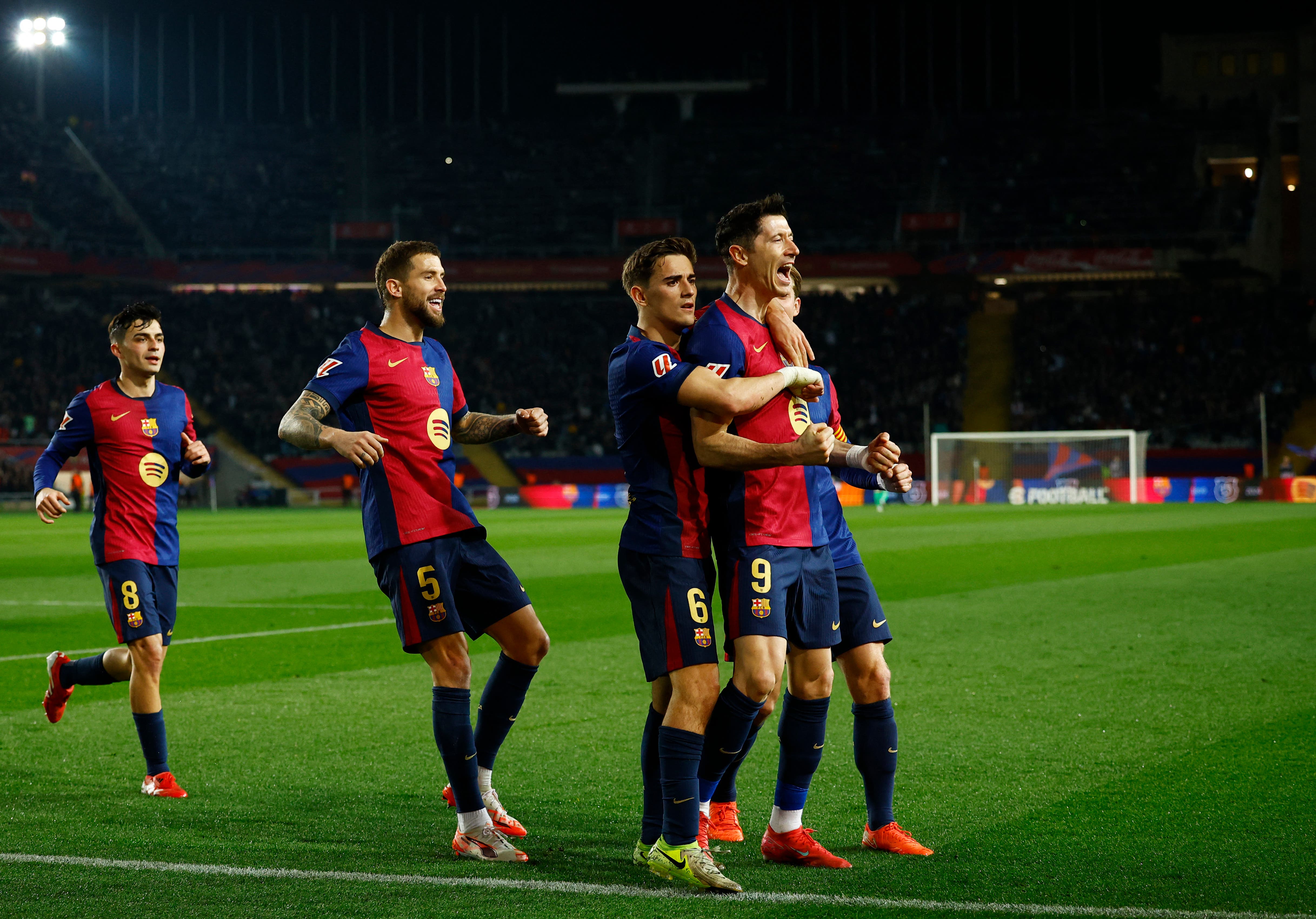 Barcelona's Robert Lewandowski celebrates scoring their first goal with teammates