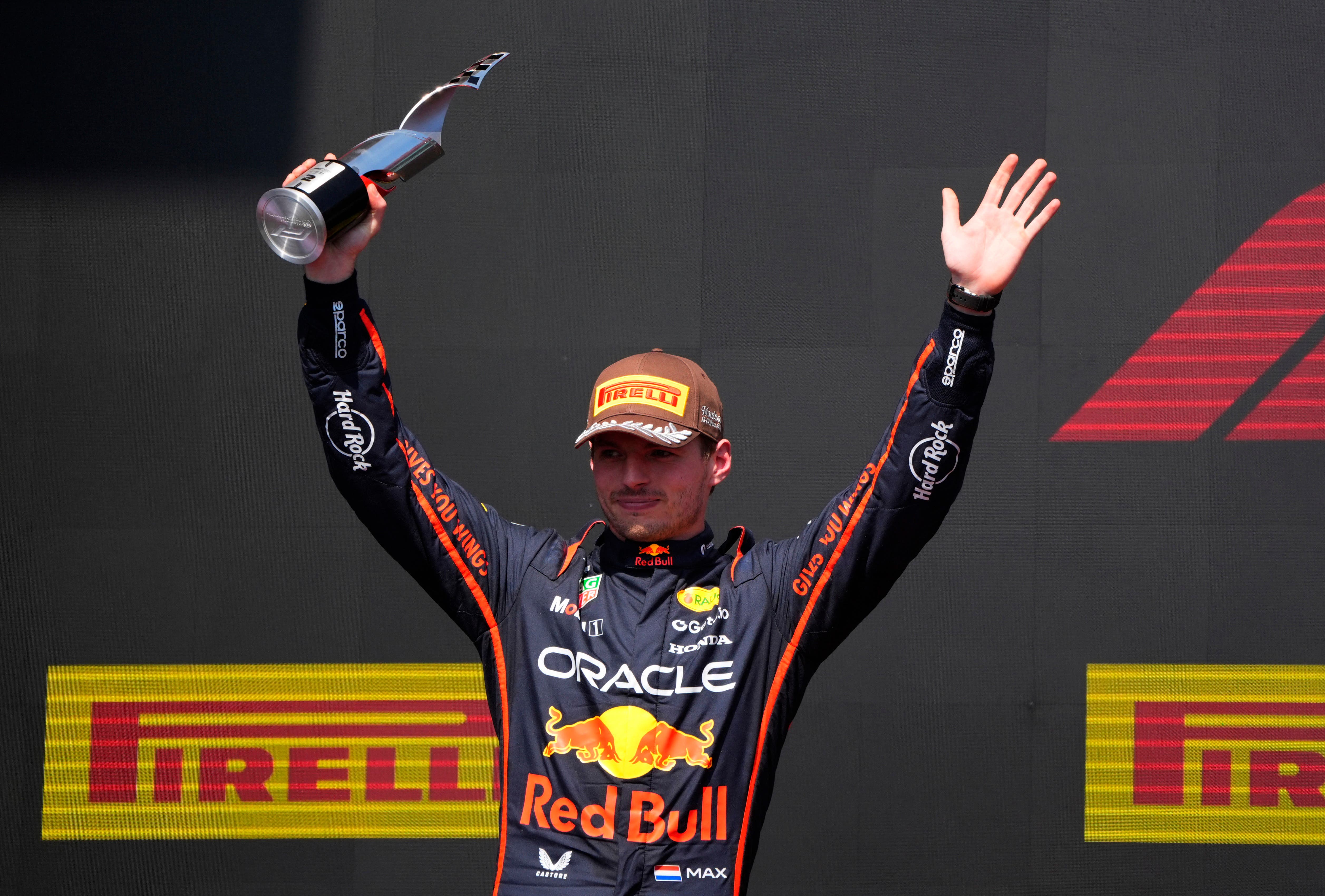 Max Verstappen lifting his trophy at the 2025 Canadian Grand Prix.