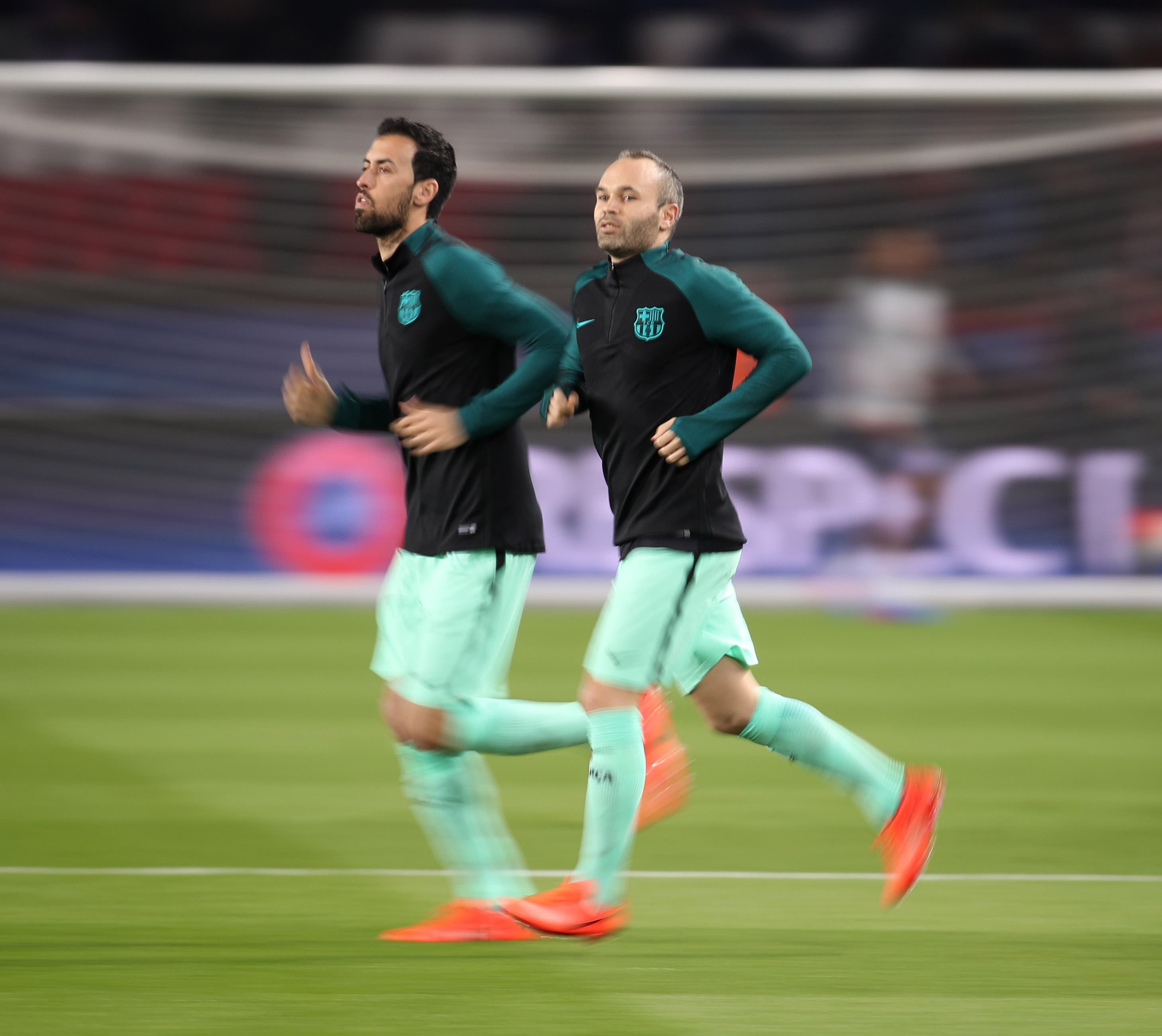 Iniesta and Busquets warming up