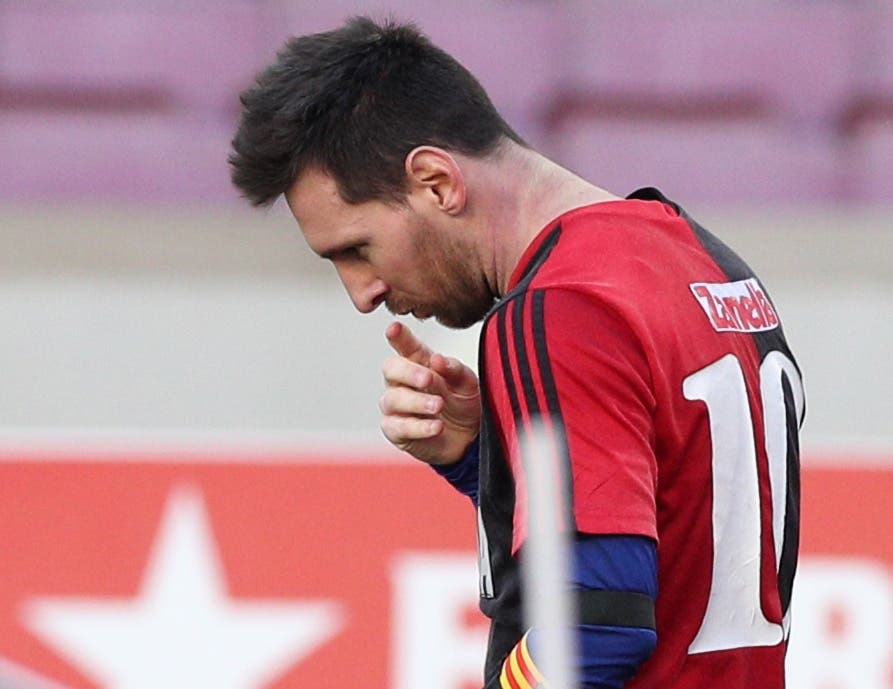 FC Barcelona's Lionel Messi celebrates scoring their fourth goal wearing a Newell's Old Boys shirt in reference to former player Diego Maradona