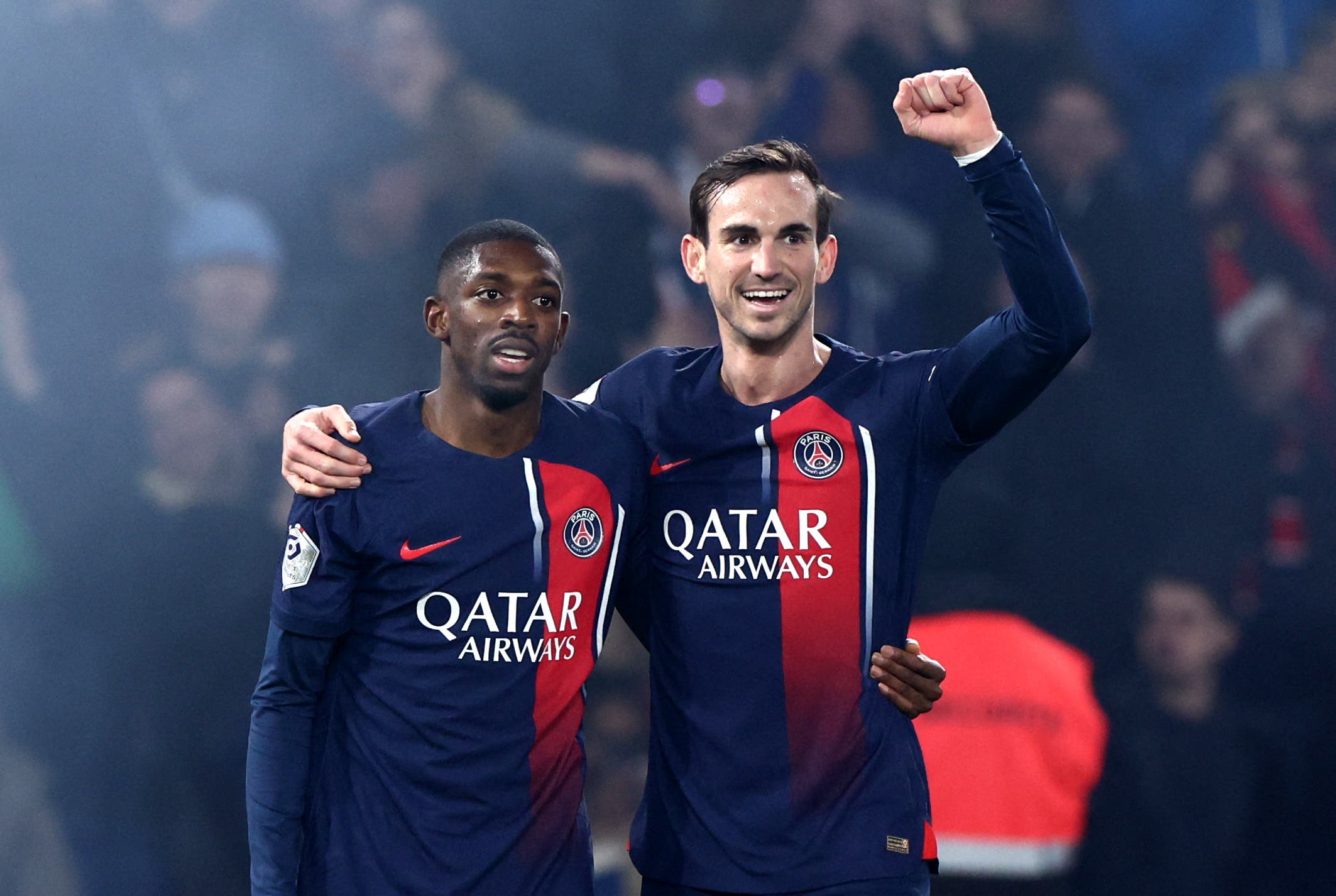 Paris St Germain's Fabian Ruiz and Ousmane Dembele celebrate their second goal an own goal scored