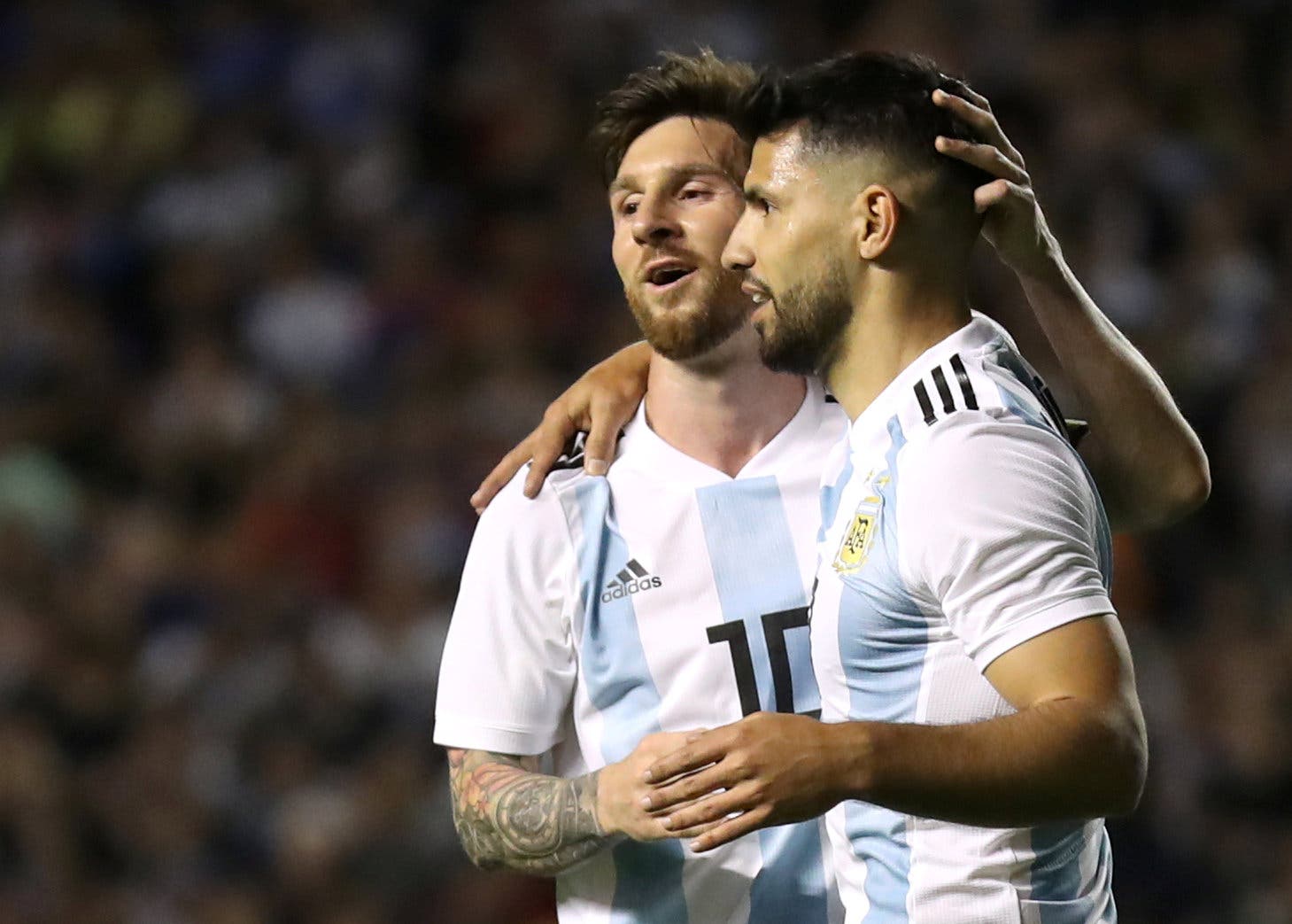 Argentina's Sergio Aguero celebrates scoring their fourth goal with Lionel Messi