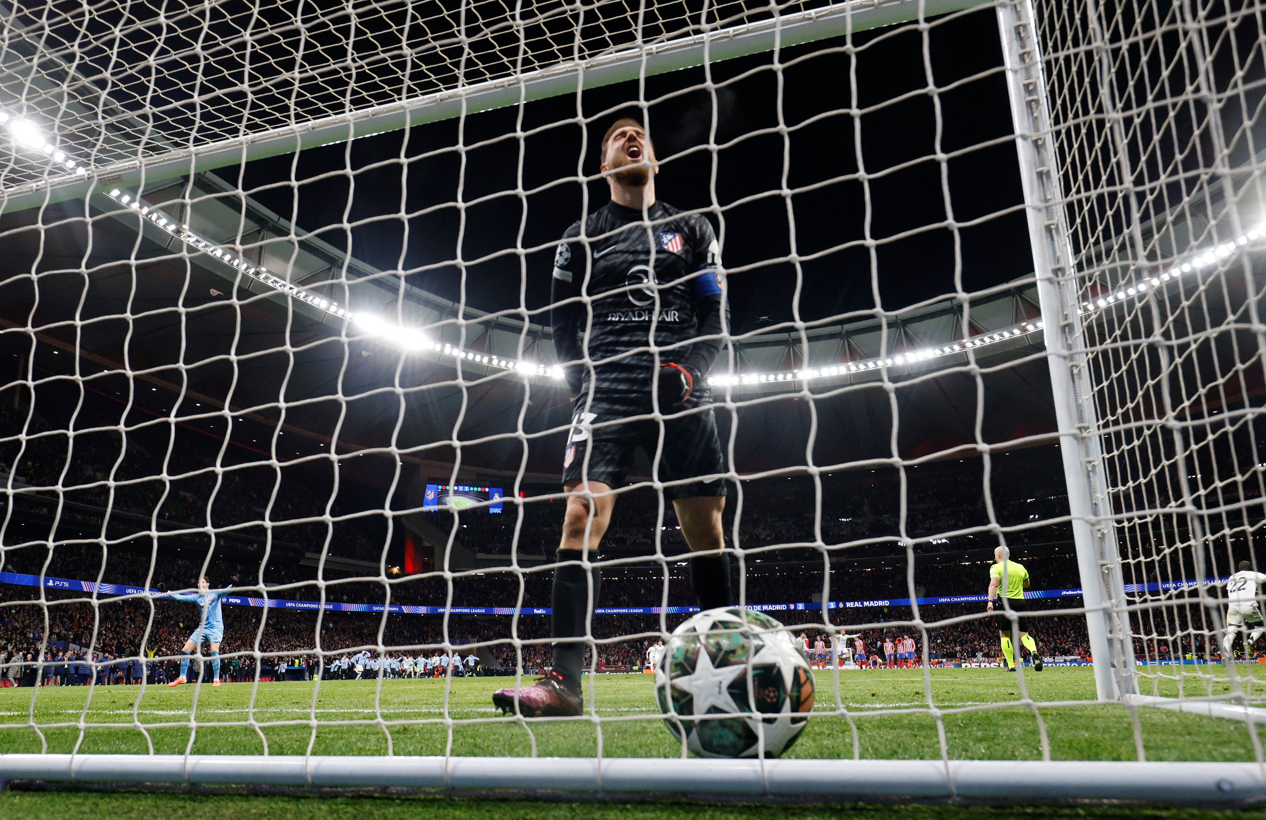 Atletico Madrid's Jan Oblak looks after Real Madrid's Antonio Rudiger scores a penalty to win the penalty shootout