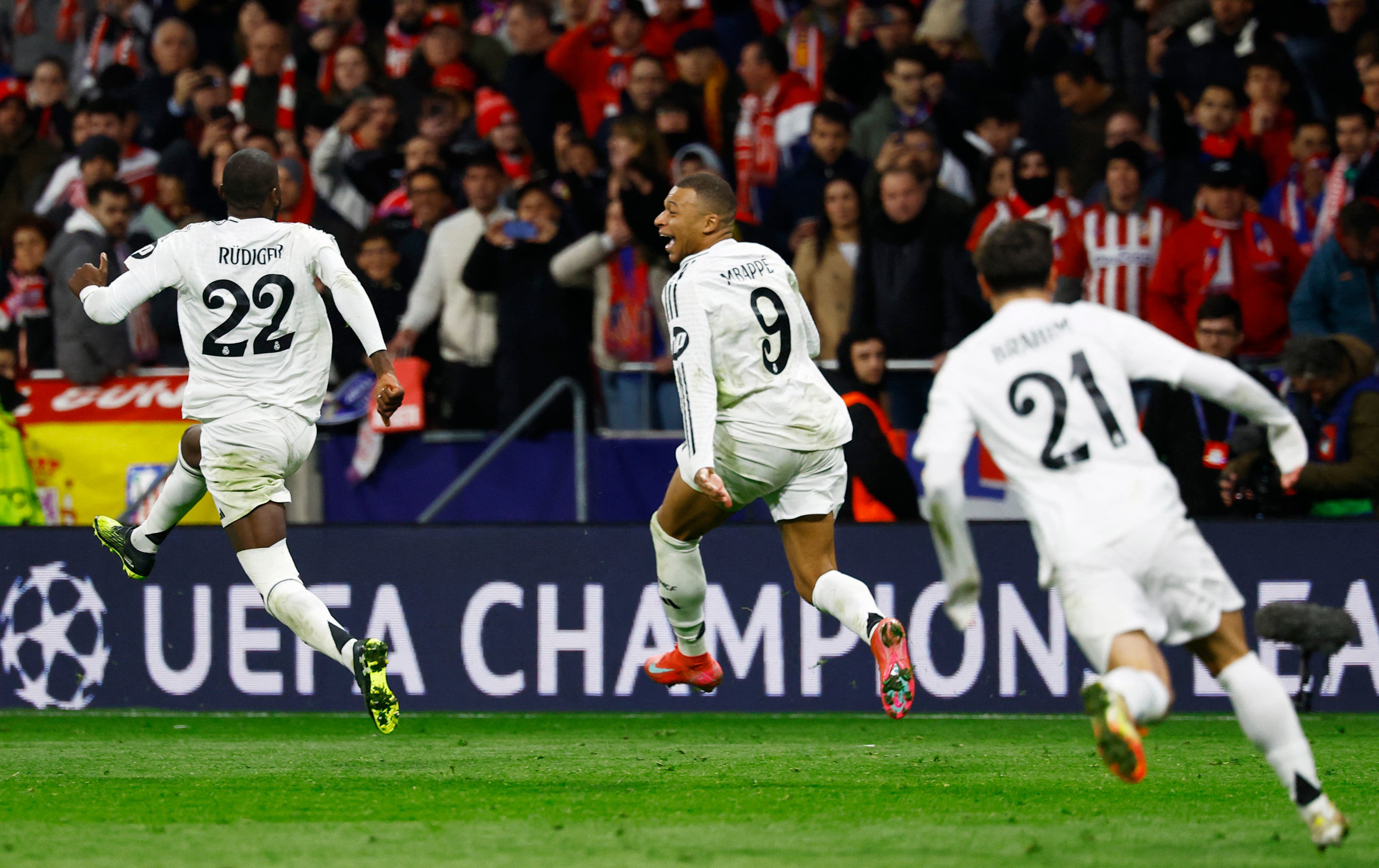 Soccer Football - Champions League - Round of 16 - Second Leg - Atletico Madrid v Real Madrid - Metropolitano, Madrid, Spain - March 12, 2025 Real Madrid's Kylian Mbappe and Antonio Rudiger celebrate after the match REUTERS/Susana Vera