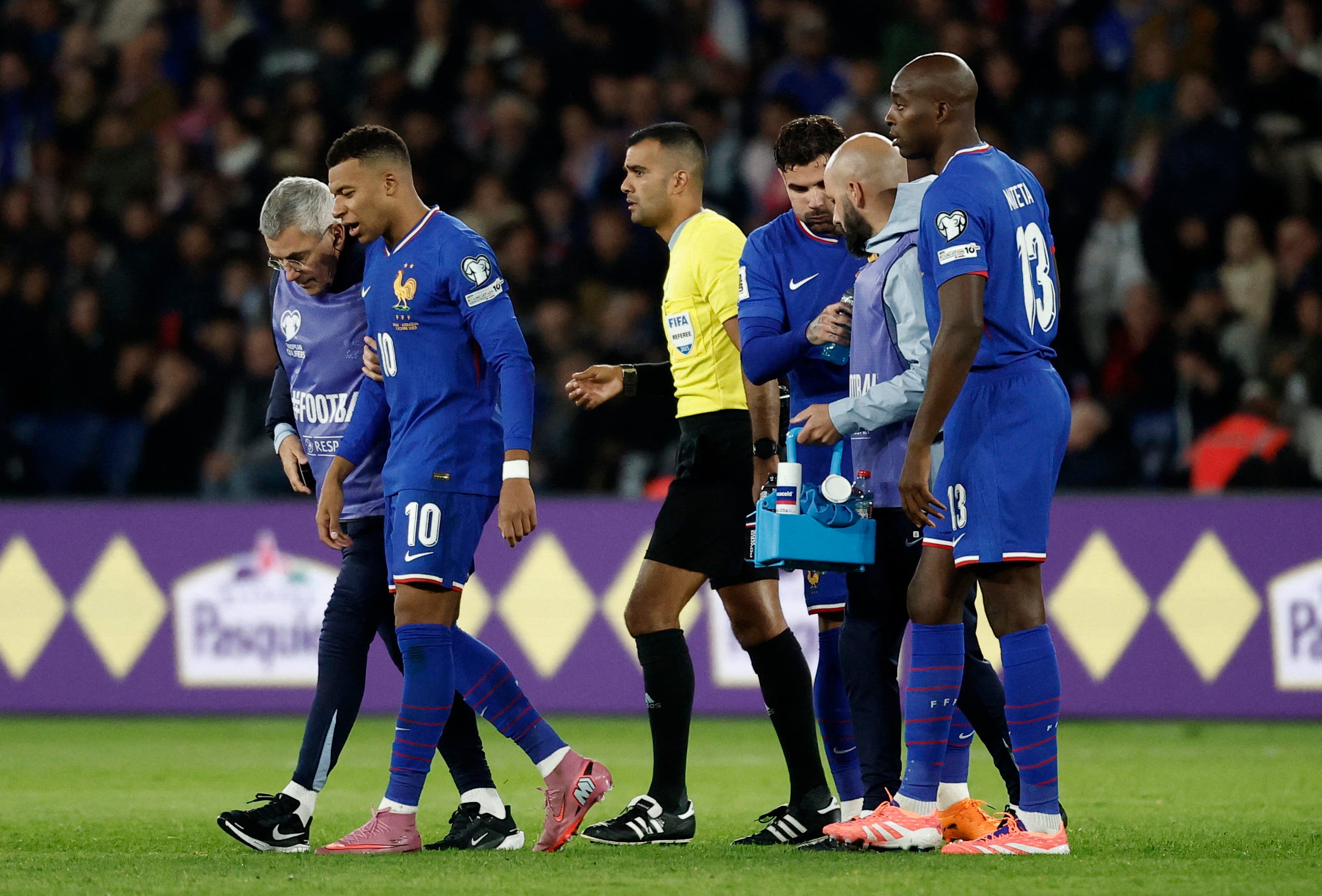 Soccer Football - FIFA World Cup - UEFA Qualifiers - Group D - France v Azerbaijan - Parc des Princes, Paris, France - October 10, 2025 France's Kylian Mbappe reacts after sustaining an injury REUTERS/Benoit Tessier