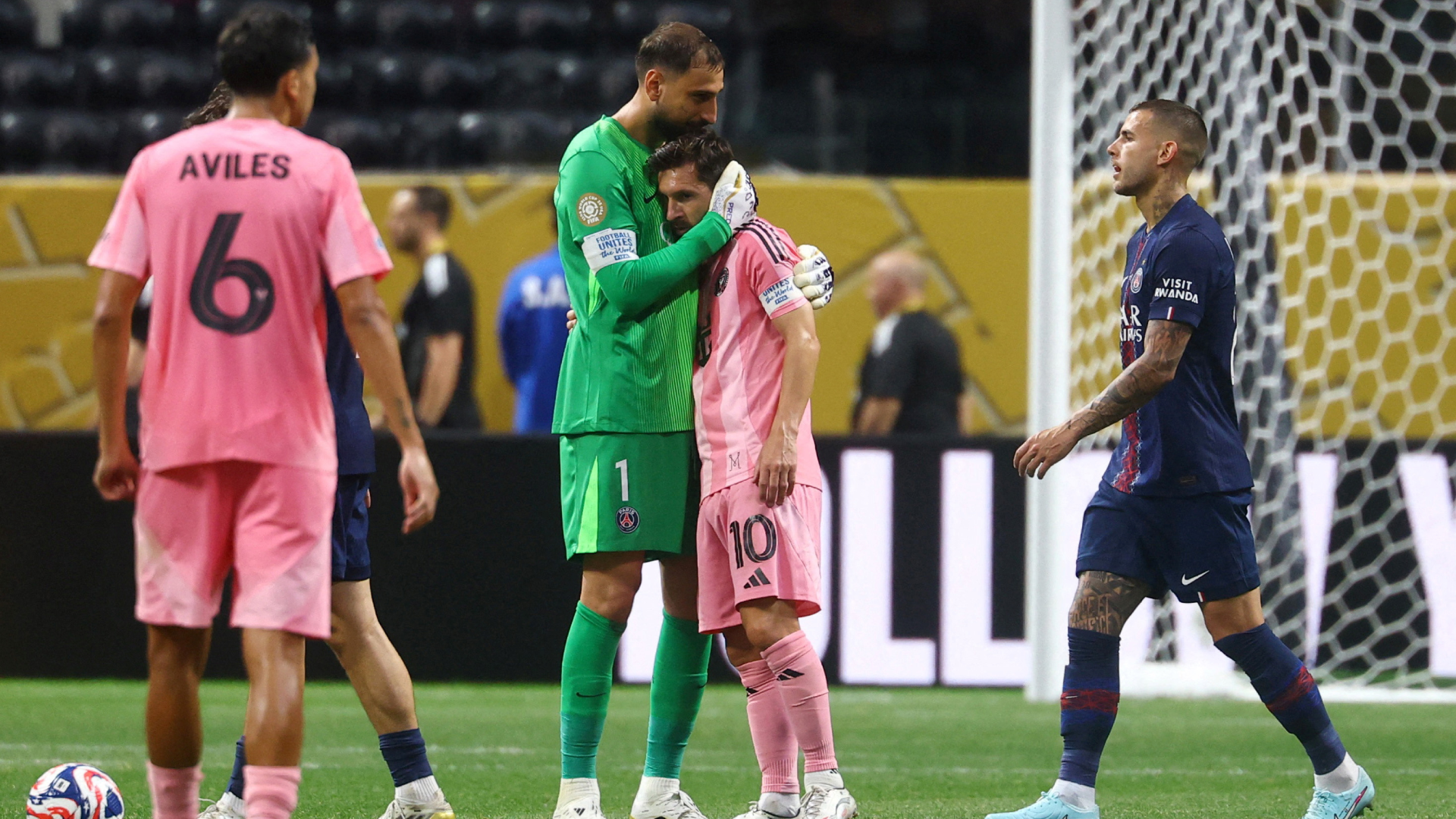 Lionel Messi is consoled by Gianluigi Donnaruma after the Club World Cup match between Paris Saint-Germain and Inter Miami.