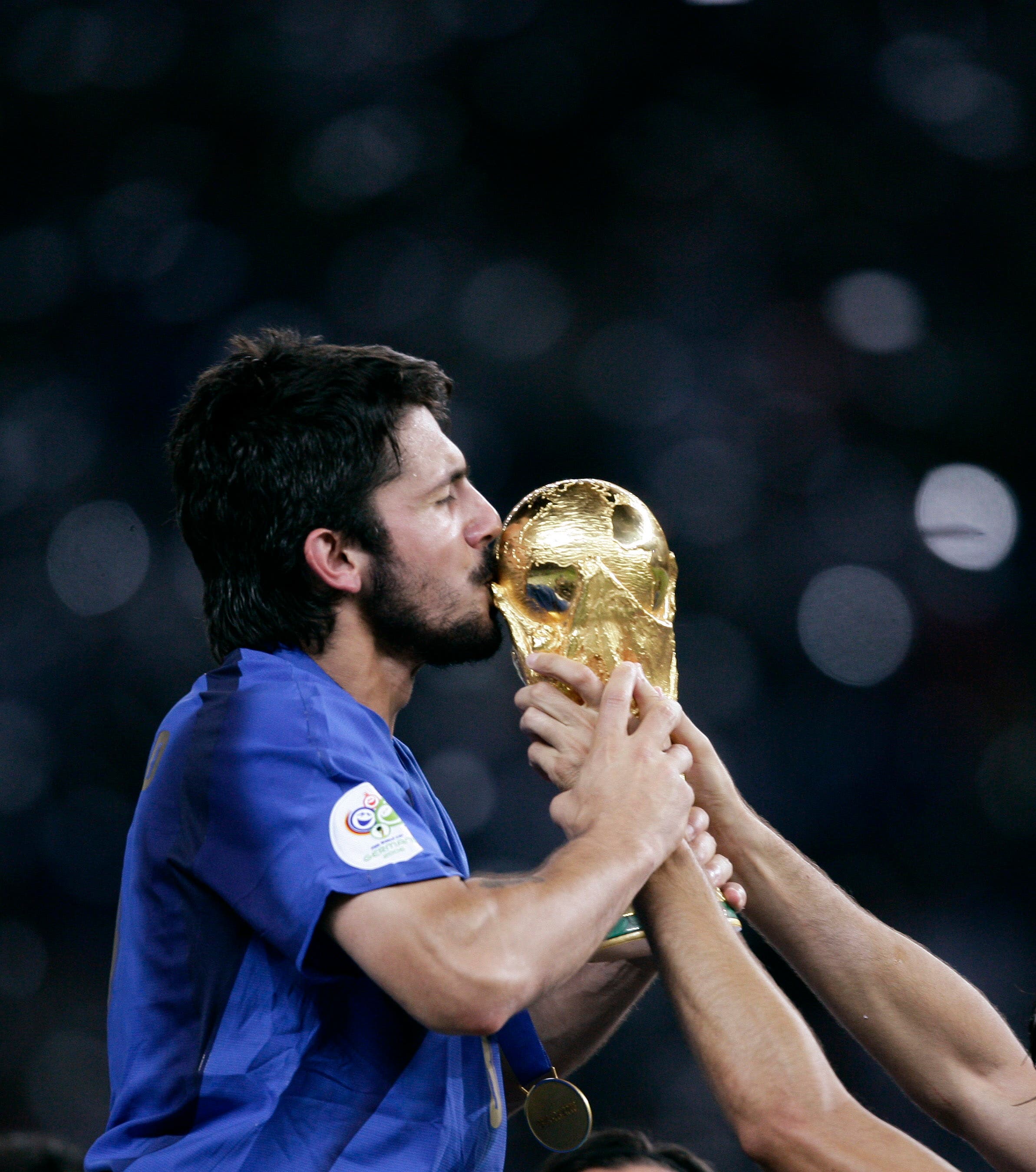 Italy's Gennaro Gattuso kisses the World Cup Trophy after the World Cup 2006 final soccer match between Italy and France in Berlin