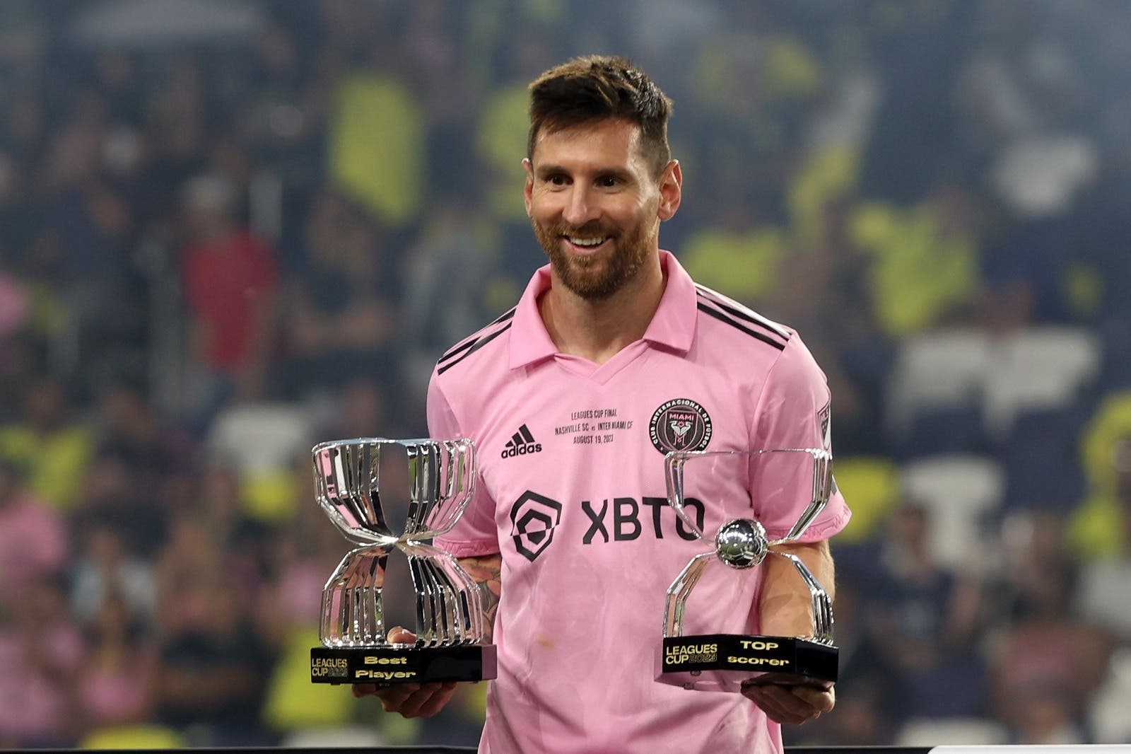 Lionel Messi with his golden boot and mvp trophy at the 2023 Leagues Cup