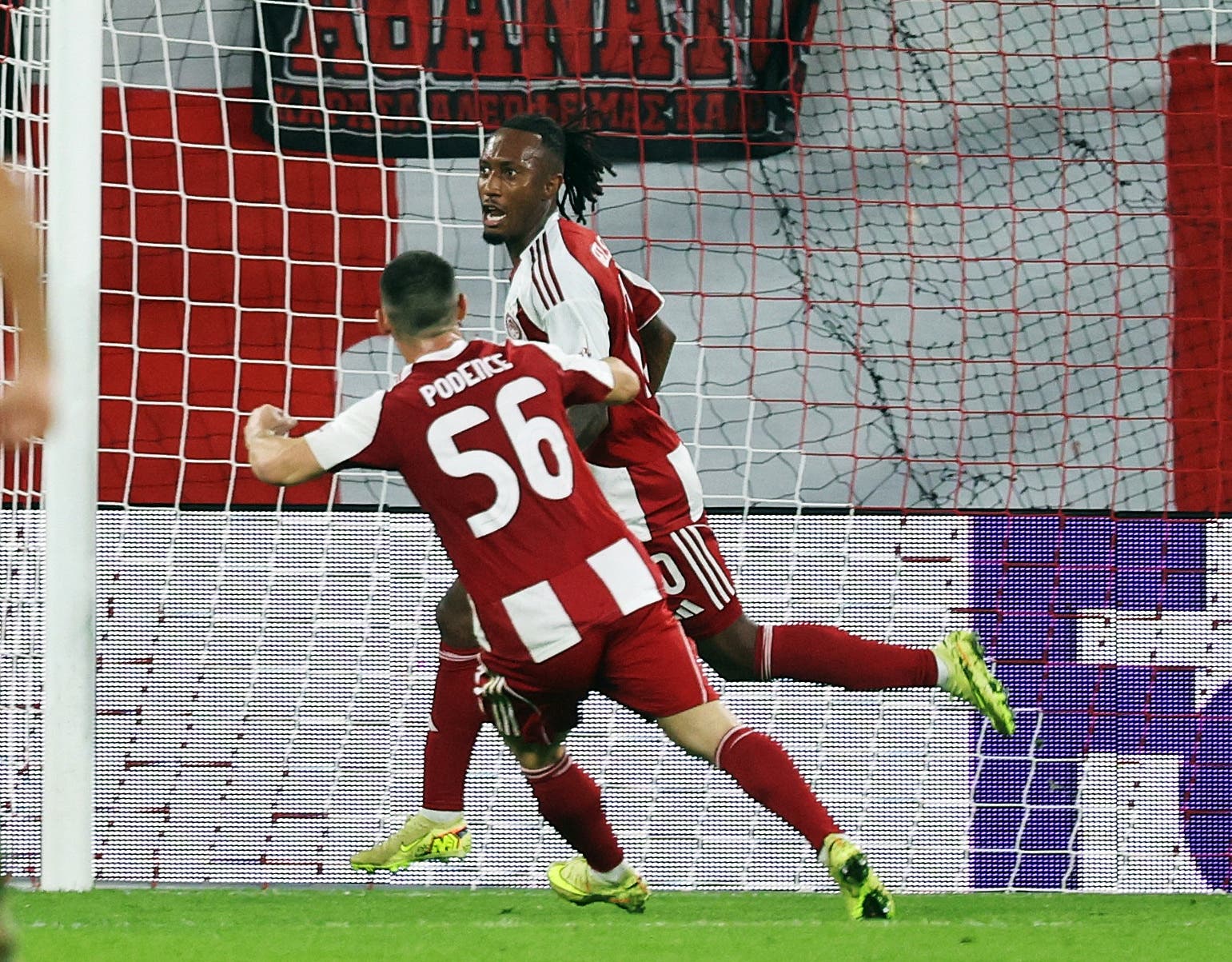 Soccer Football - UEFA Champions League - Olympiacos v PSV Eindhoven - Karaiskakis Stadium, Piraeus, Greece - November 4, 2025 Olympiacos' Gelson Martins celebrates scoring their first goal with Daniel Podence REUTERS/Louisa Gouliamaki