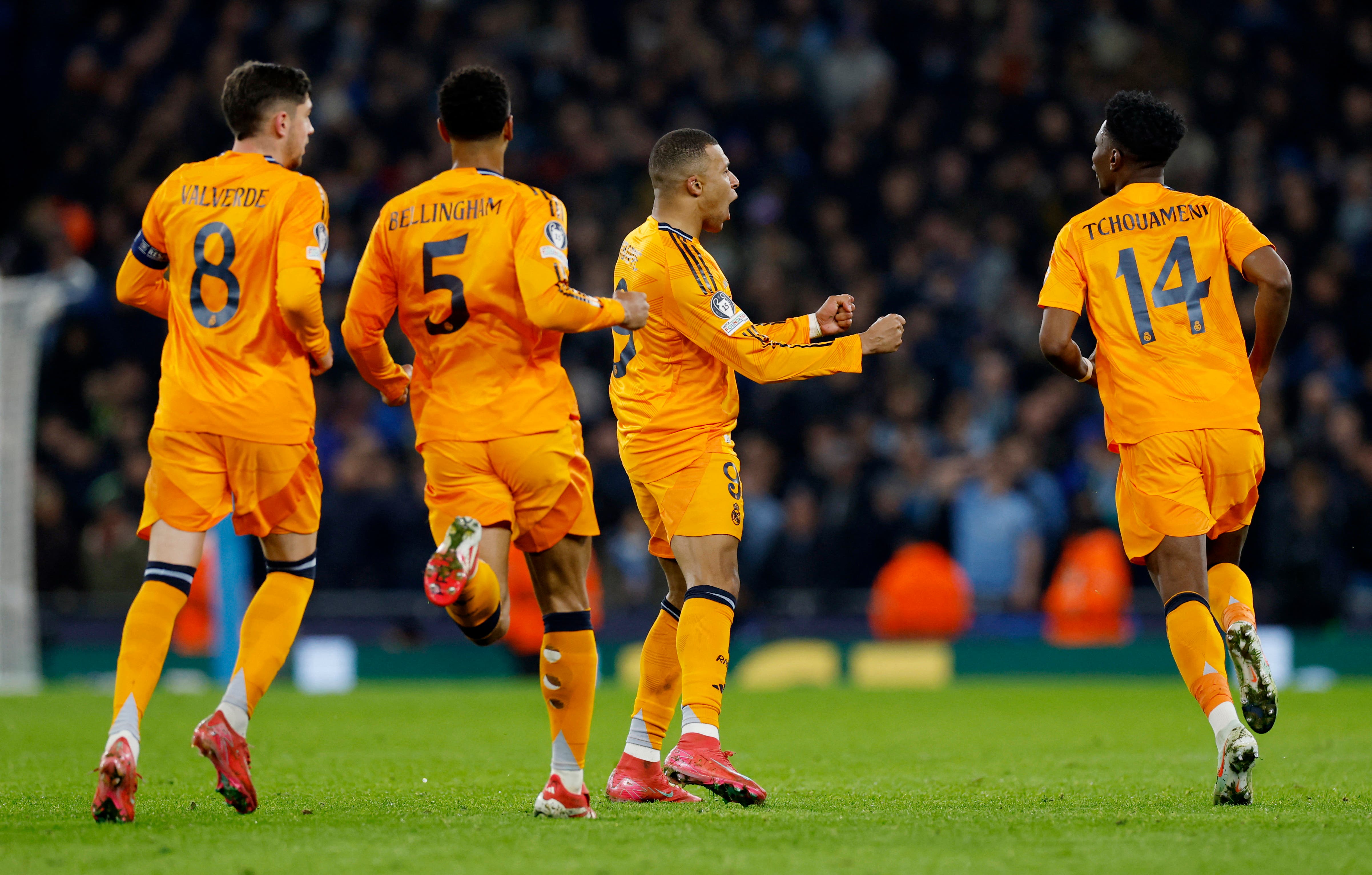 Real Madrid's Kylian Mbappe celebrates scoring their first goal with teammates