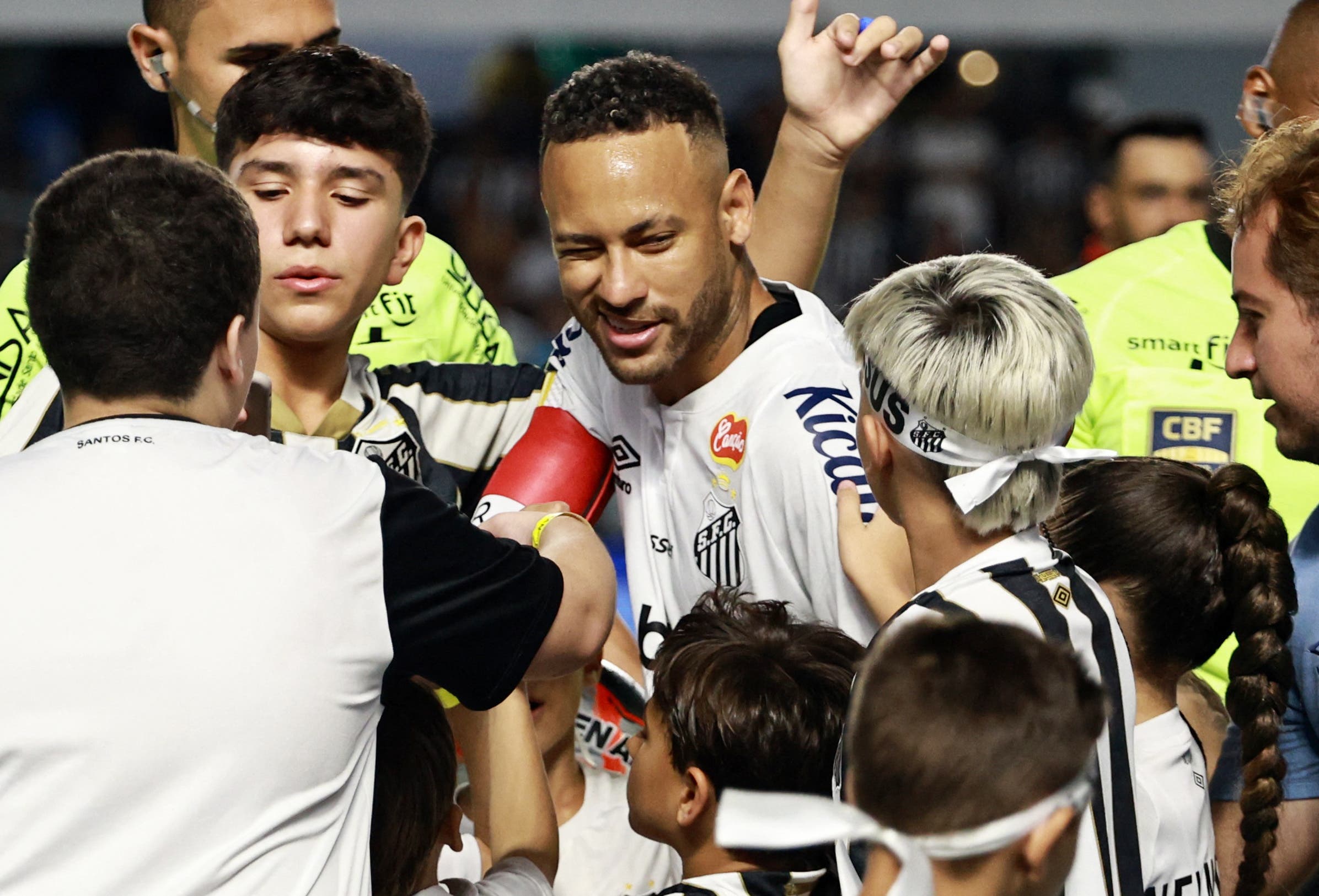 Santos' Neymar with fans before the match