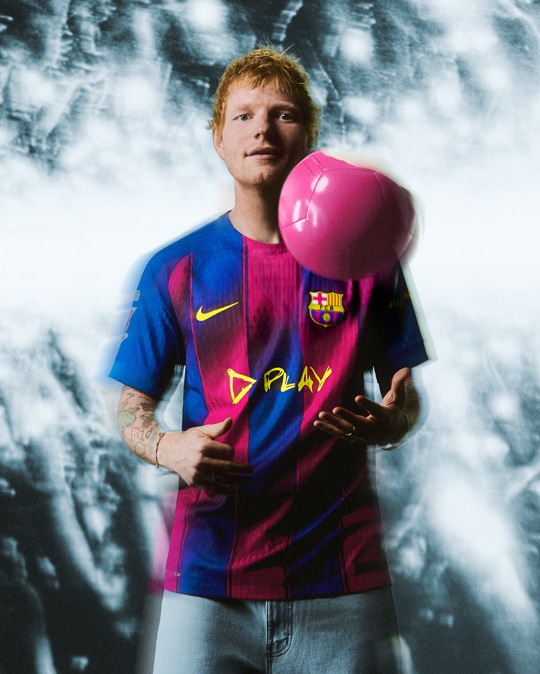 Ed sheeran wears BArcelona's new jersey for El Clásico.