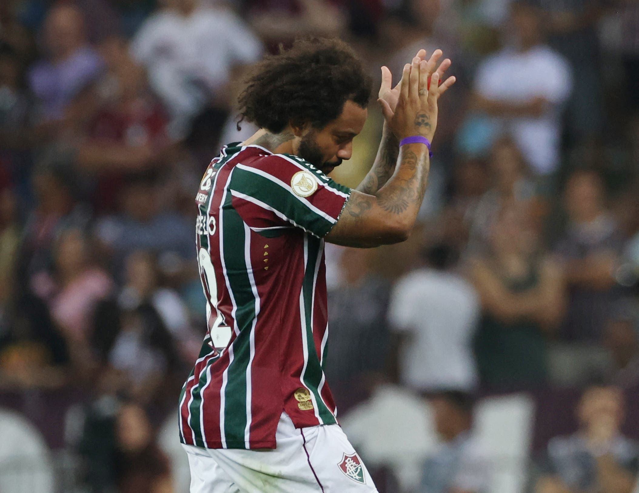 Fluminense's Marcelo walks off the pitch