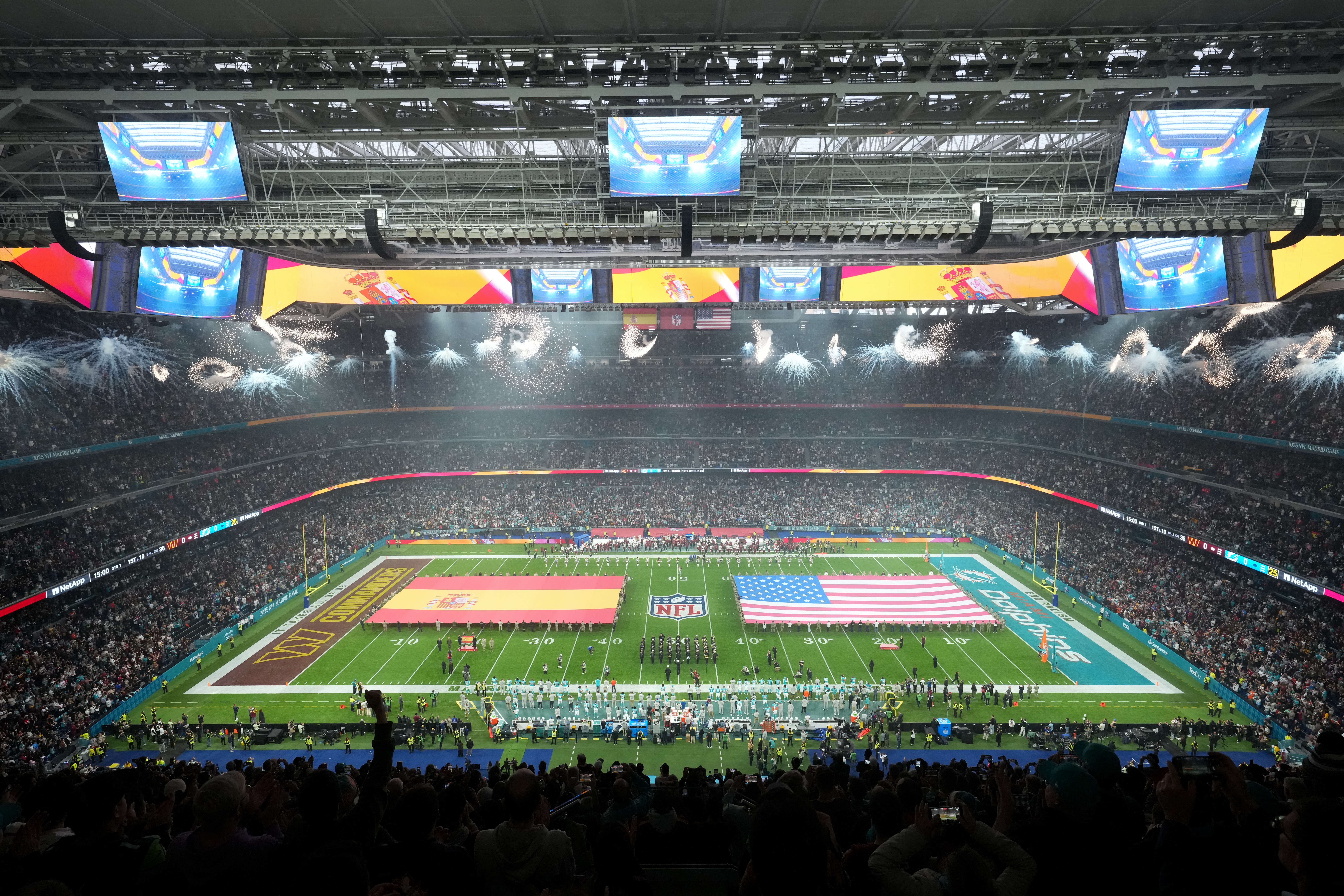 Nov 16, 2025; Madrid, Spain; The interior of the stadium during the national anthems prior to the 2025 NFL Madrid Game between the Miami Dolphins and the Washington Commanders at Santiago Bernabeu Stadium. Mandatory Credit: Kirby Lee-Imagn Images