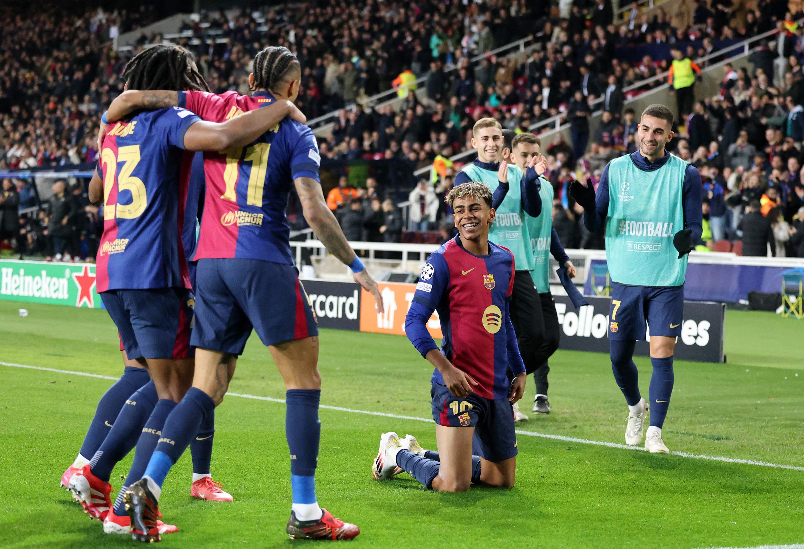 Barcelona players celebrate after Lamine Yamal scored against Atalanta in Champions League