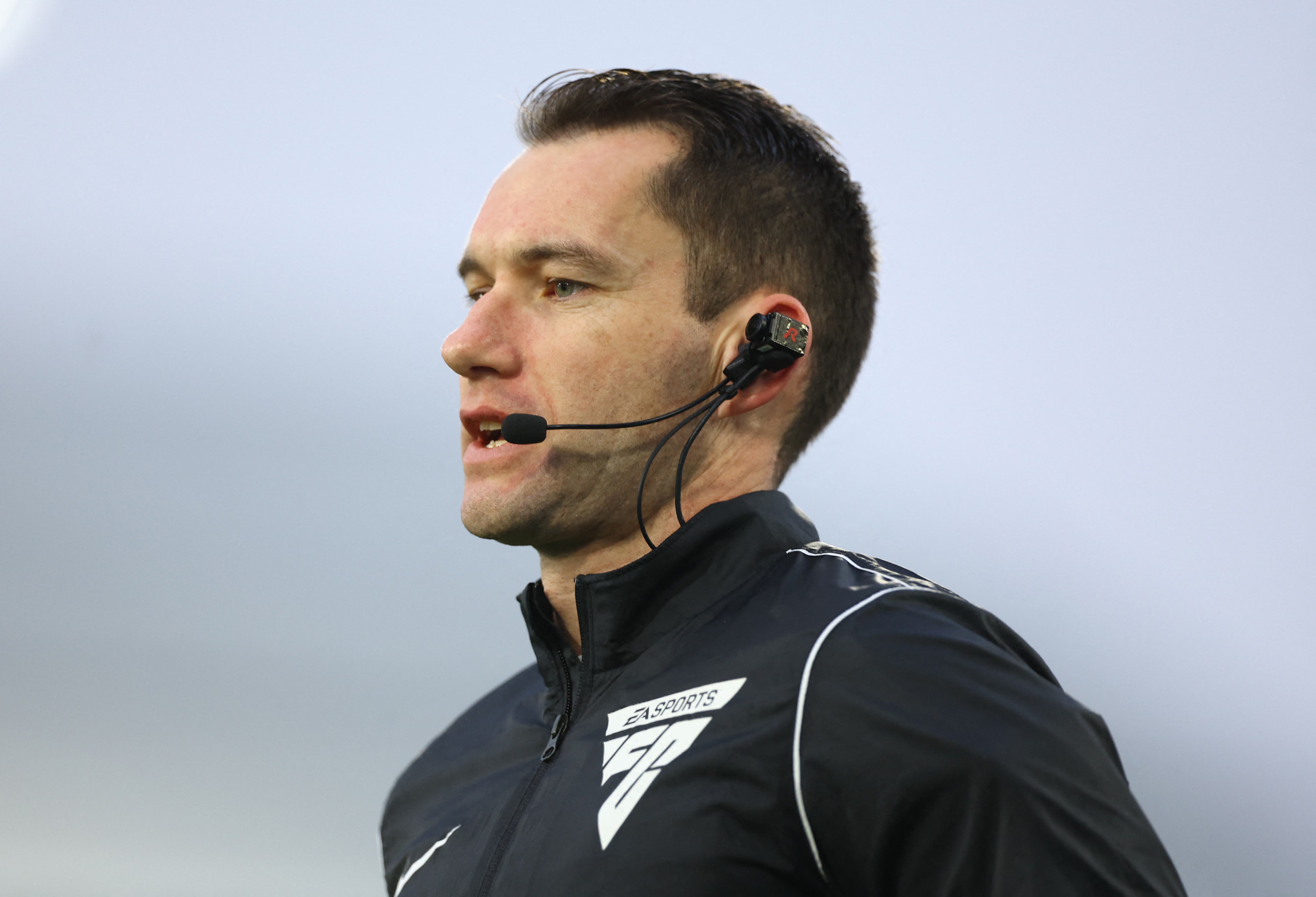 Referee Jarred Gillett with his camera before the match 