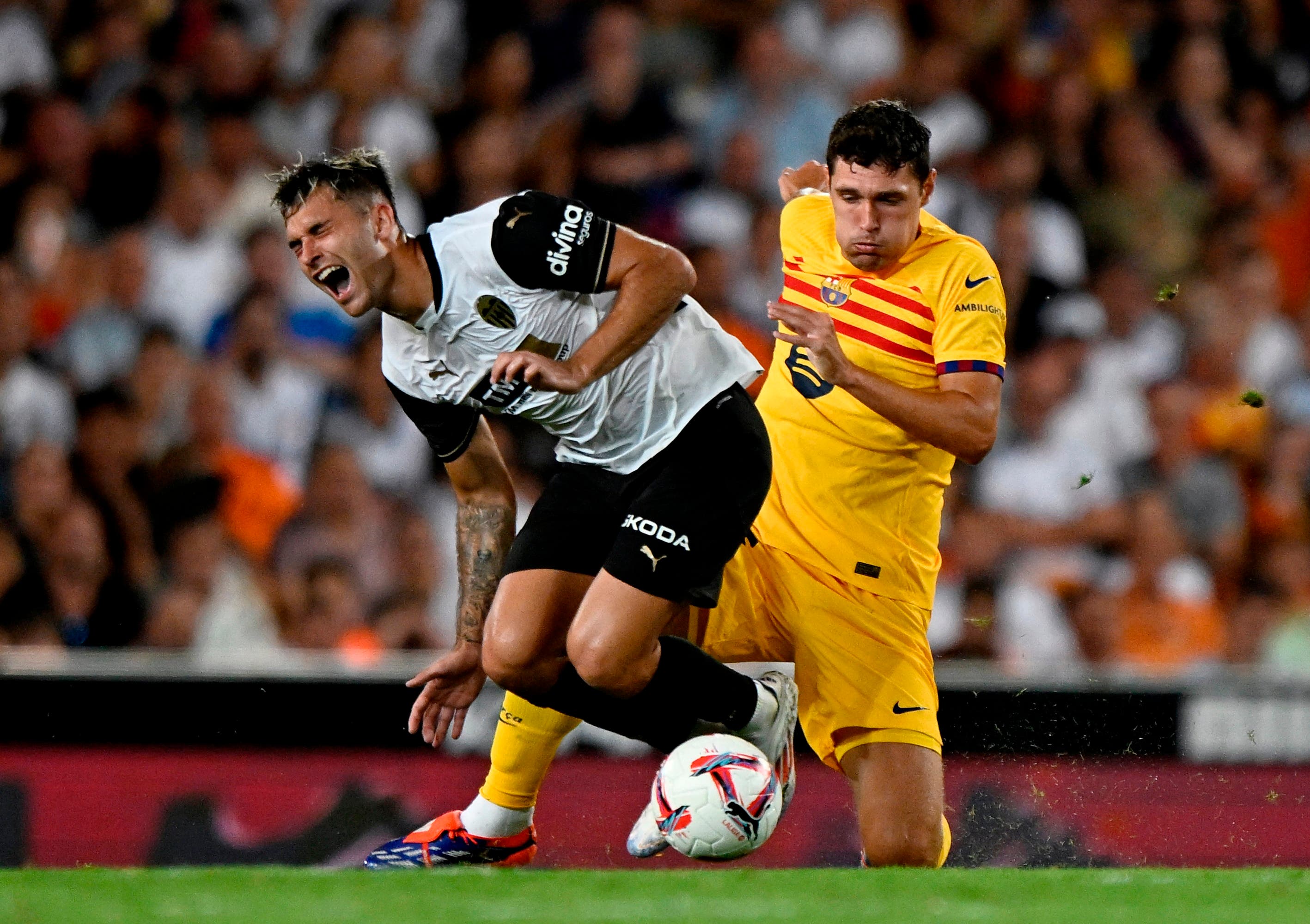 FC Barcelona's Andreas Christensen in action with Valencia's