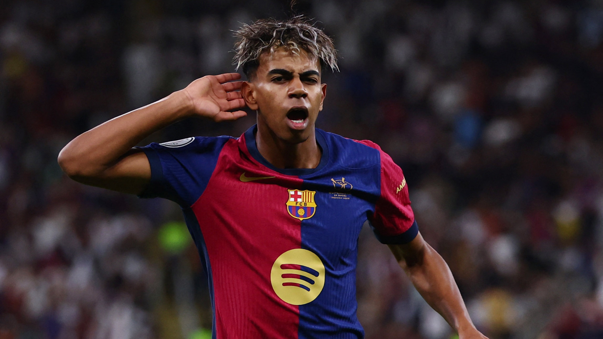 Lamine Yamal celebrating during a game with Barcelona.