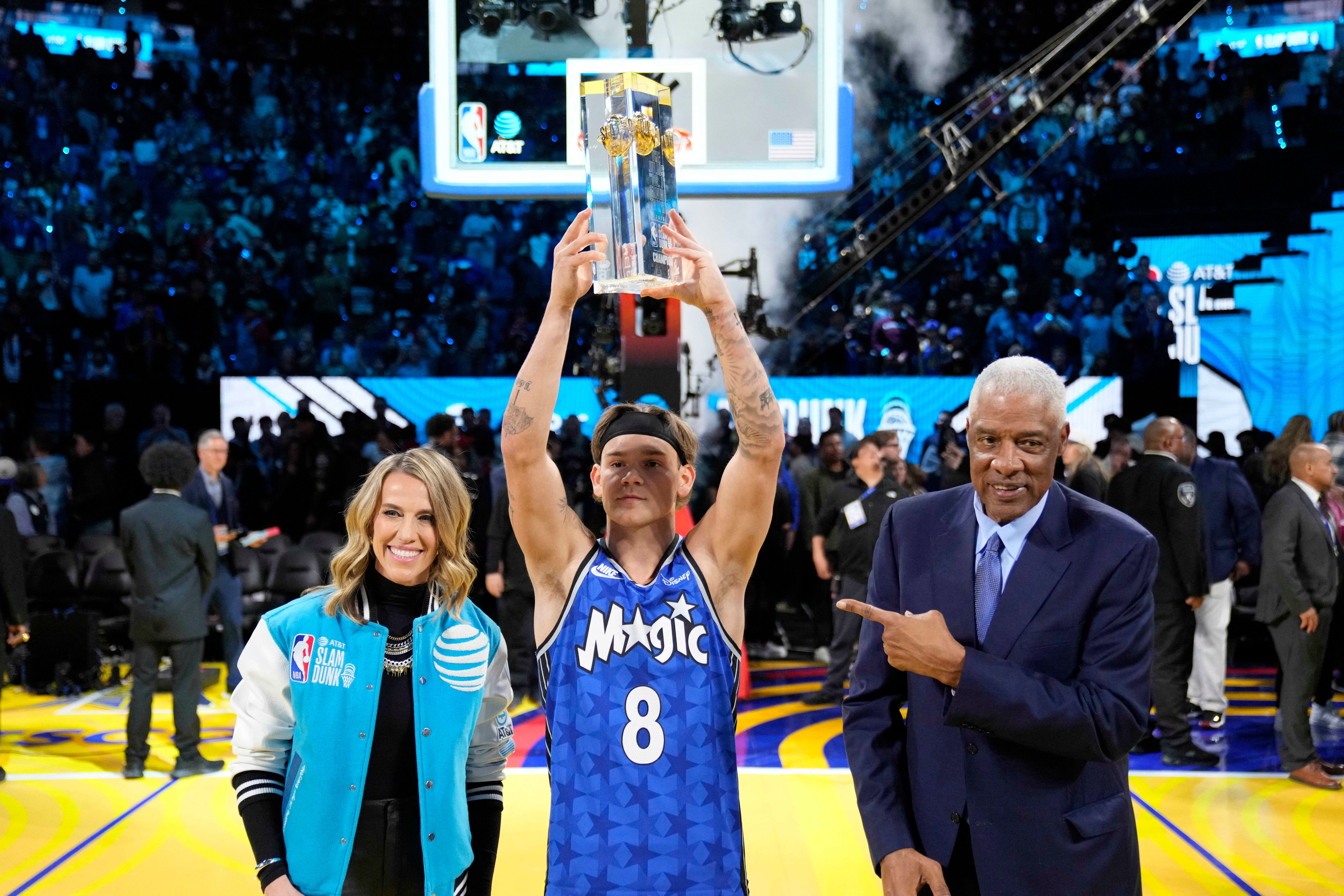 Osceola Magic guard Mac McClung celebrates with the trophy and former NBA player Julius Erving (right) after winning the slam dunk competition during All Star Saturday Night ahead of the 2025 NBA All Star Game at Chase Center.