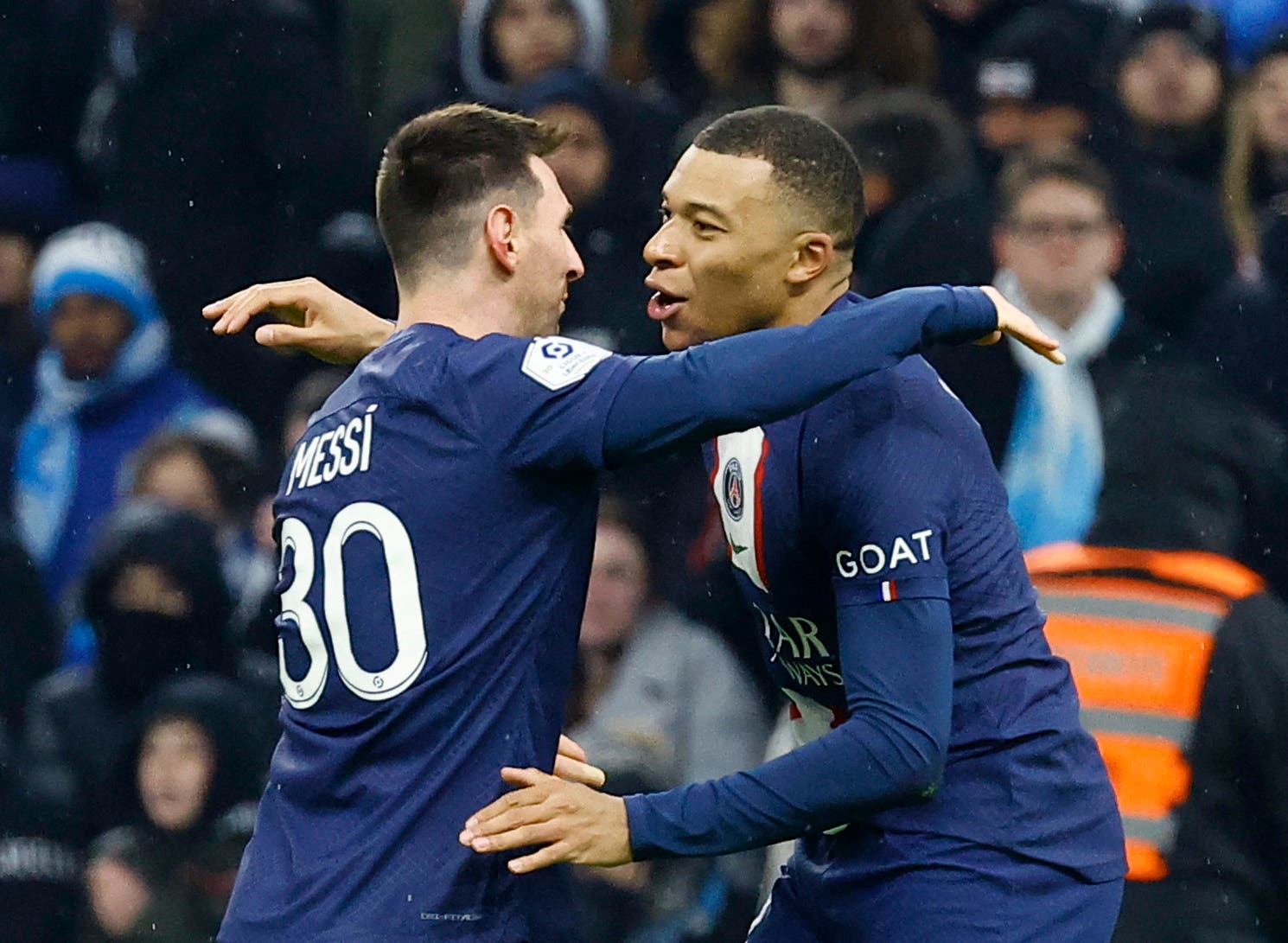 Soccer Football - Ligue 1 - Olympique de Marseille v Paris St Germain - Orange Velodrome, Marseille, France - February 26, 2023 Paris St Germain's Kylian Mbappe celebrates scoring their third goal with Lionel Messi REUTERS/Eric Gaillard
