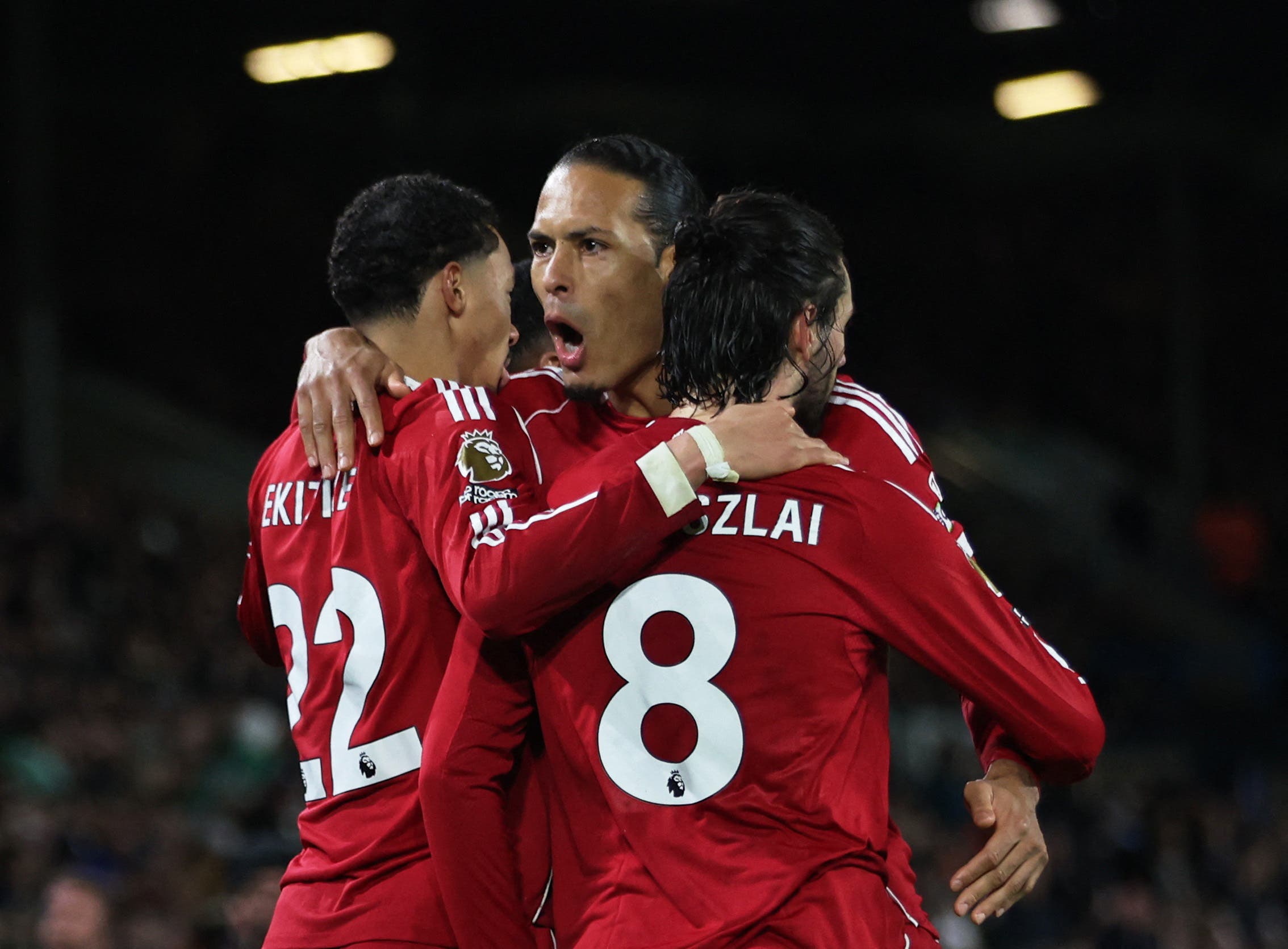 Soccer Football - Premier League - Leeds United v Liverpool - Elland Road, Leeds, Britain - December 6, 2025 Liverpool's Dominik Szoboszlai celebrates scoring their third goal with Virgil van Dijk and Hugo Ekitike REUTERS/Chris Radburn