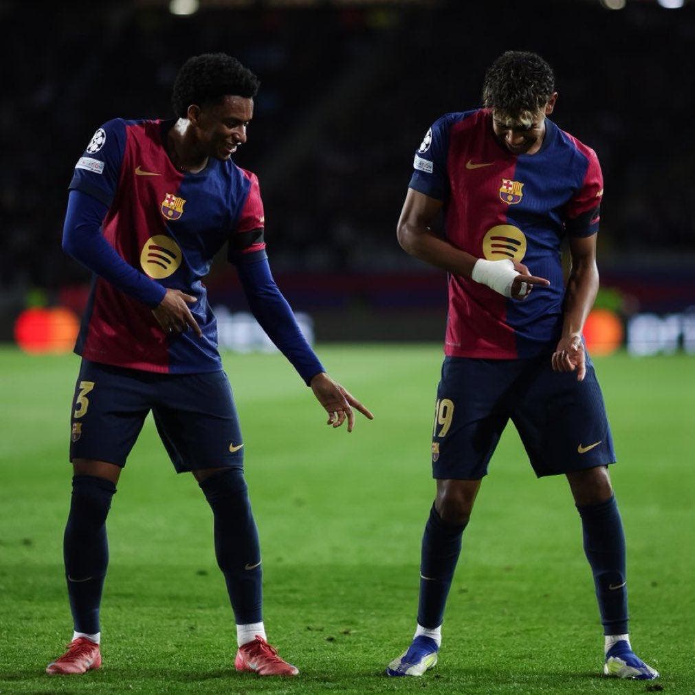 Lamine Yamal celebrates scoring with Alejandro Balde against Benfica