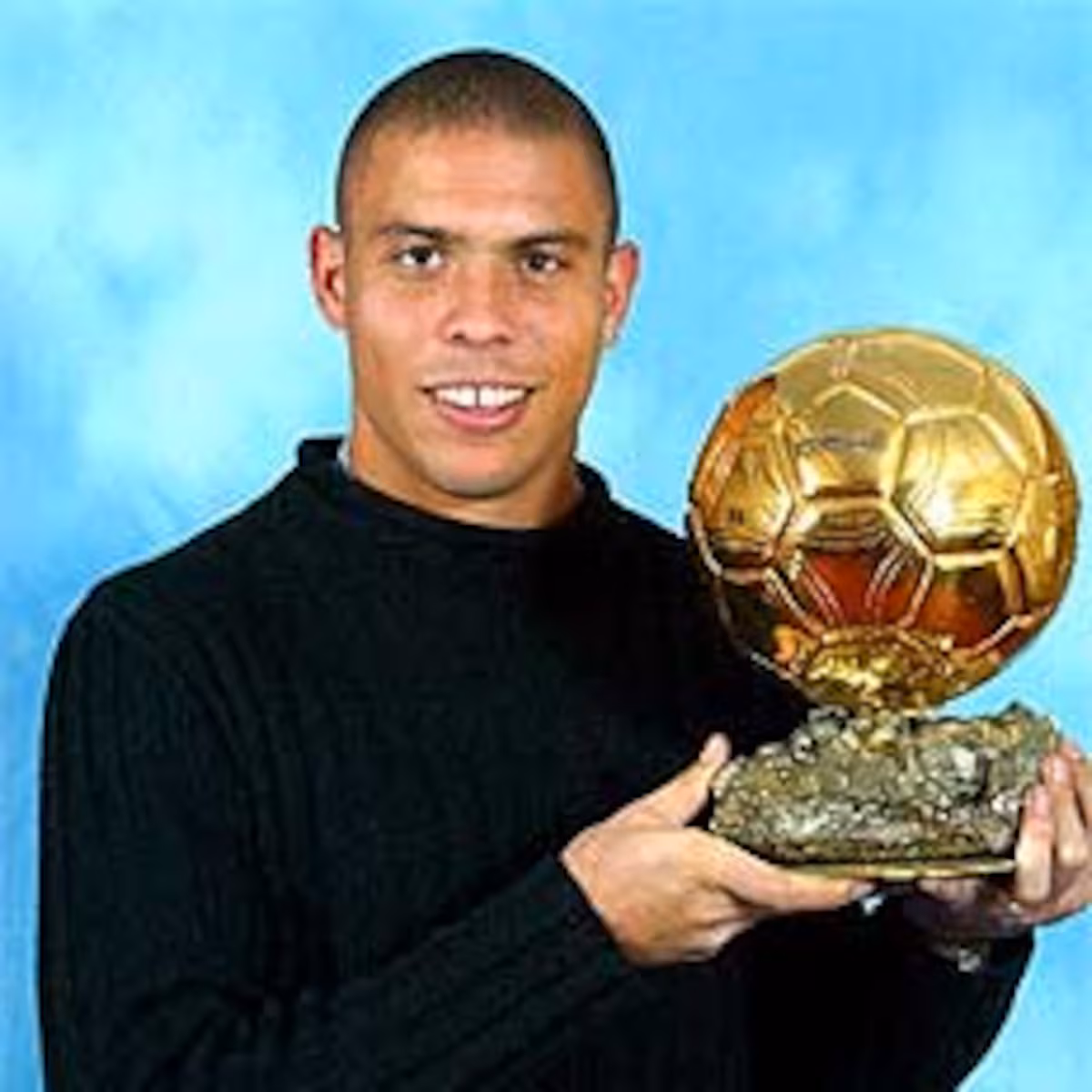 Ronaldo Nazario shows off his Ballon D'or awarded in 2002.