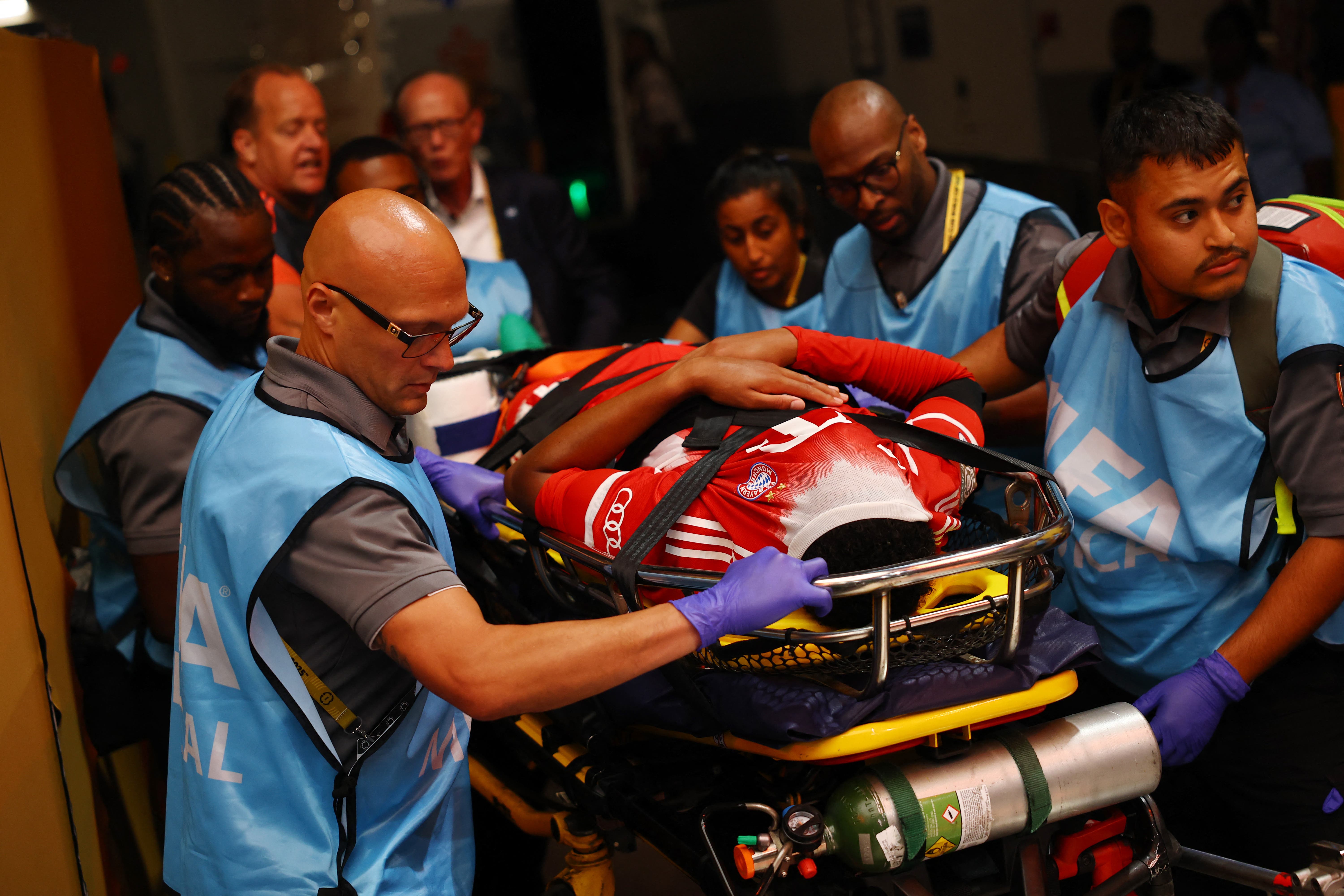 Jamal Musiala leaves the pitch after a serious injury wit Bayern Munich. 