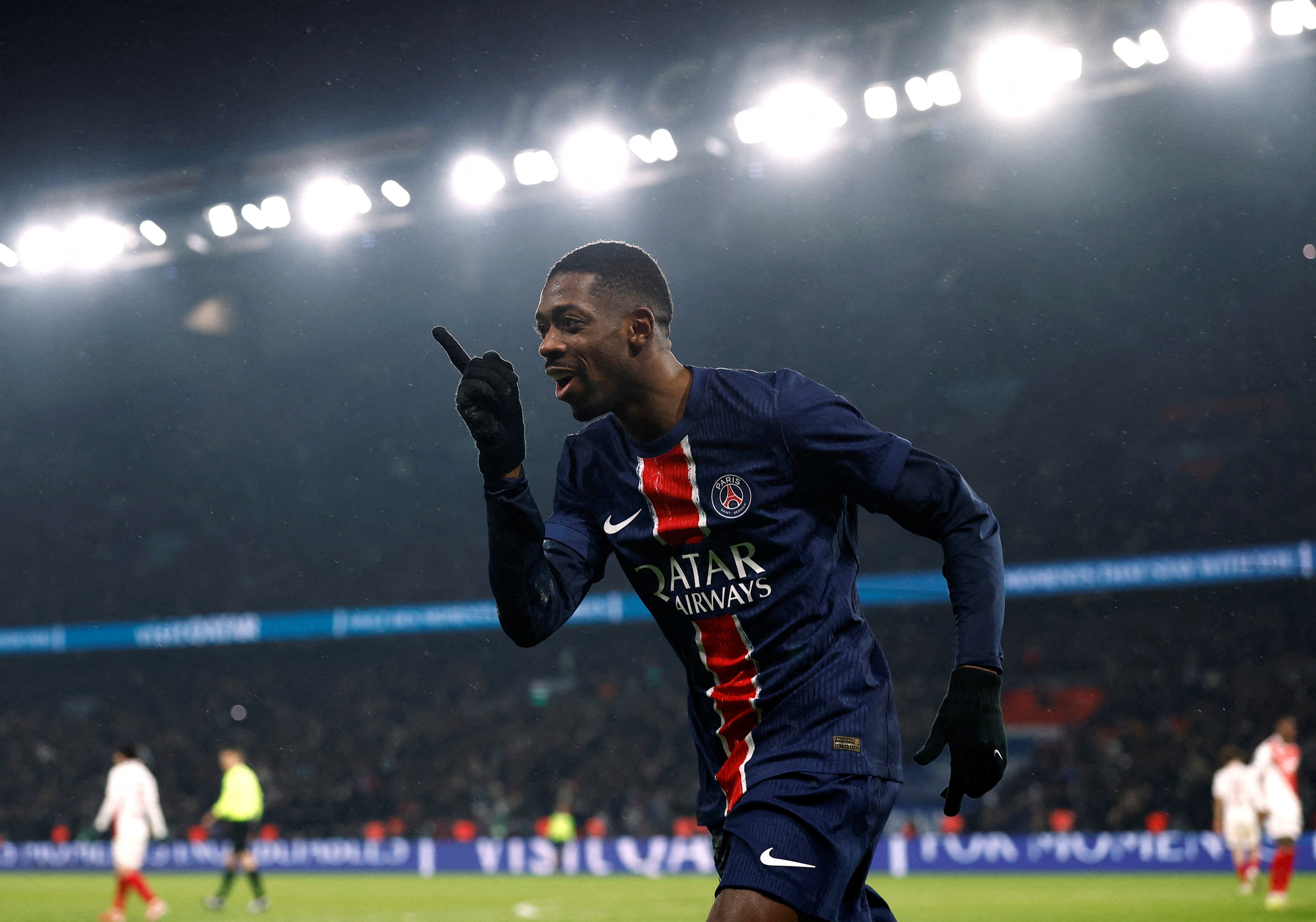 Paris St Germain's Ousmane Dembele celebrates scoring their third goal