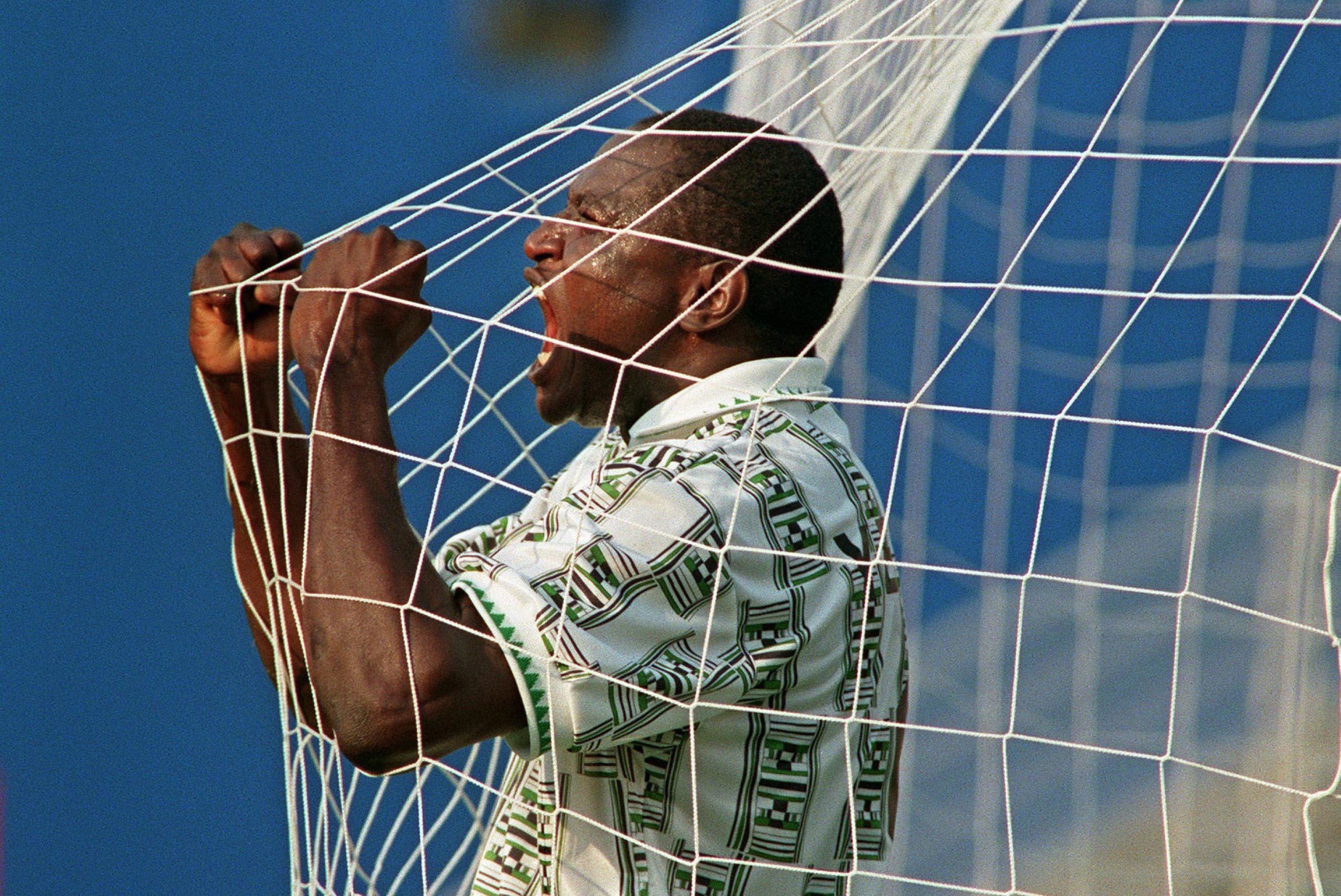 Rashidi Yekini celebrqtes a goal with Nigeria National Team.