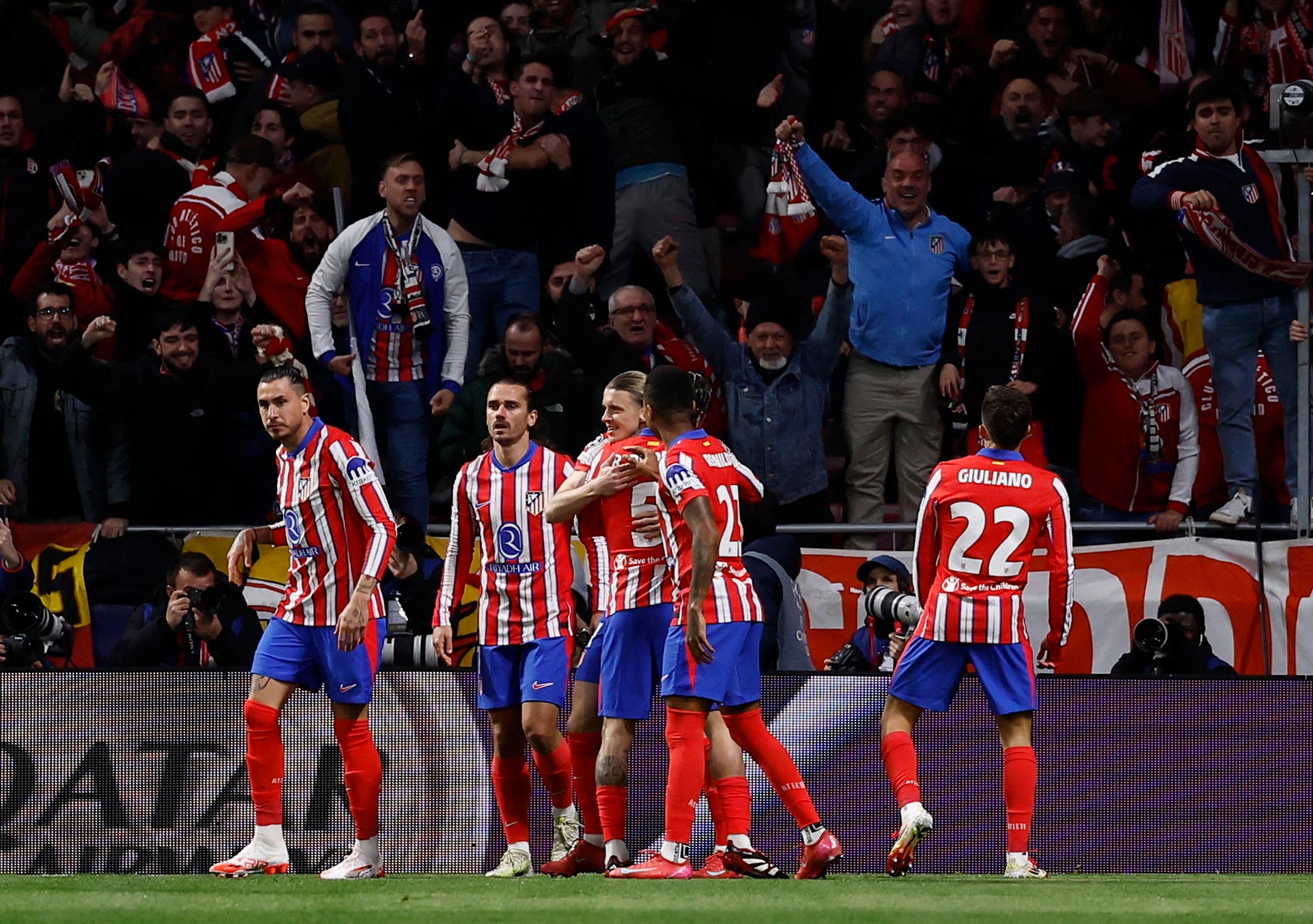 Atletico Madrid's Conor Gallagher celebrates scoring their first goal with teammates 