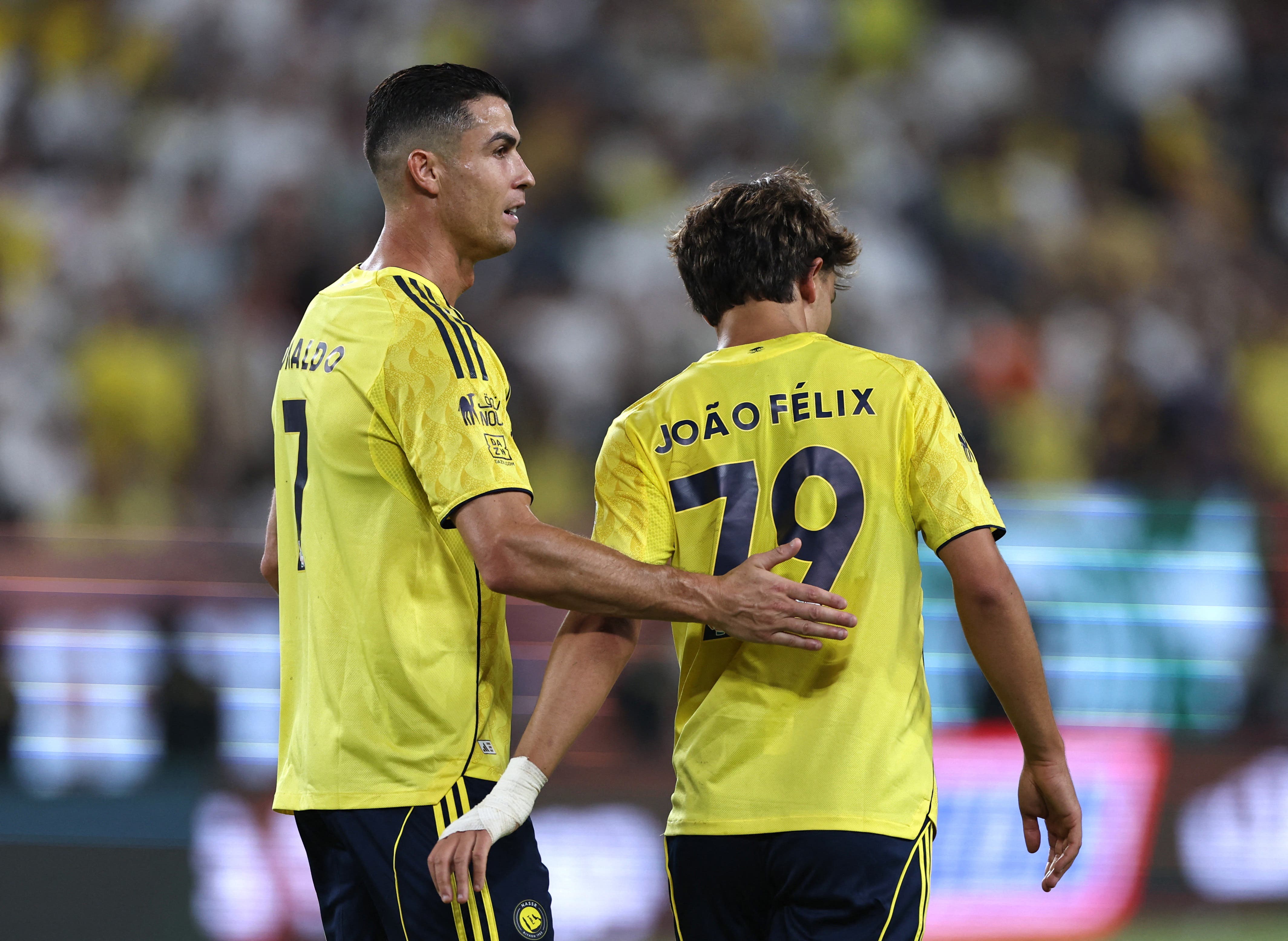 Cristiano Ronaldo alongside Joao Félix during an Al Nassr game.