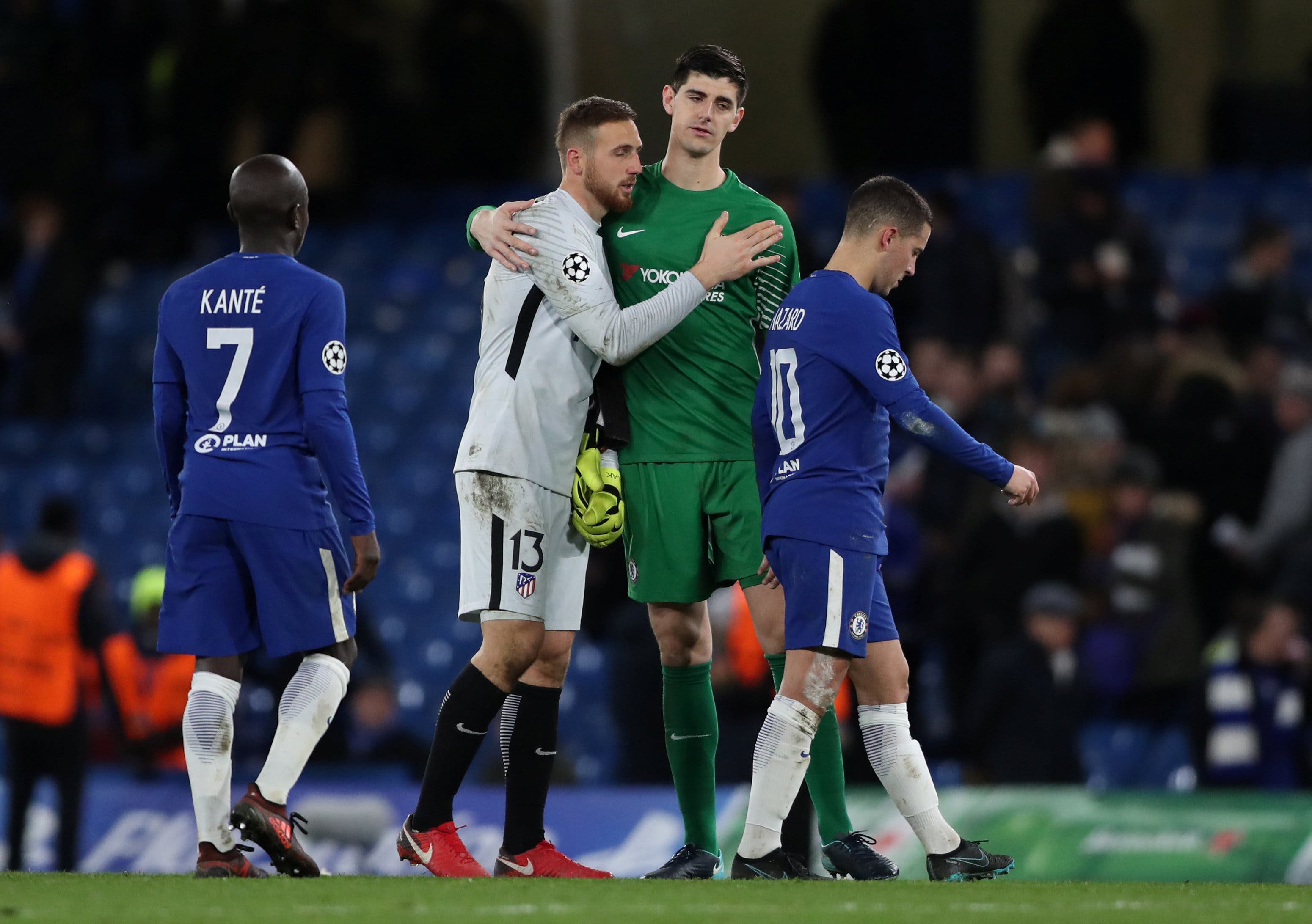 Chelsea's Thibaut Courtois and Atletico Madrid's Jan Oblak hug 