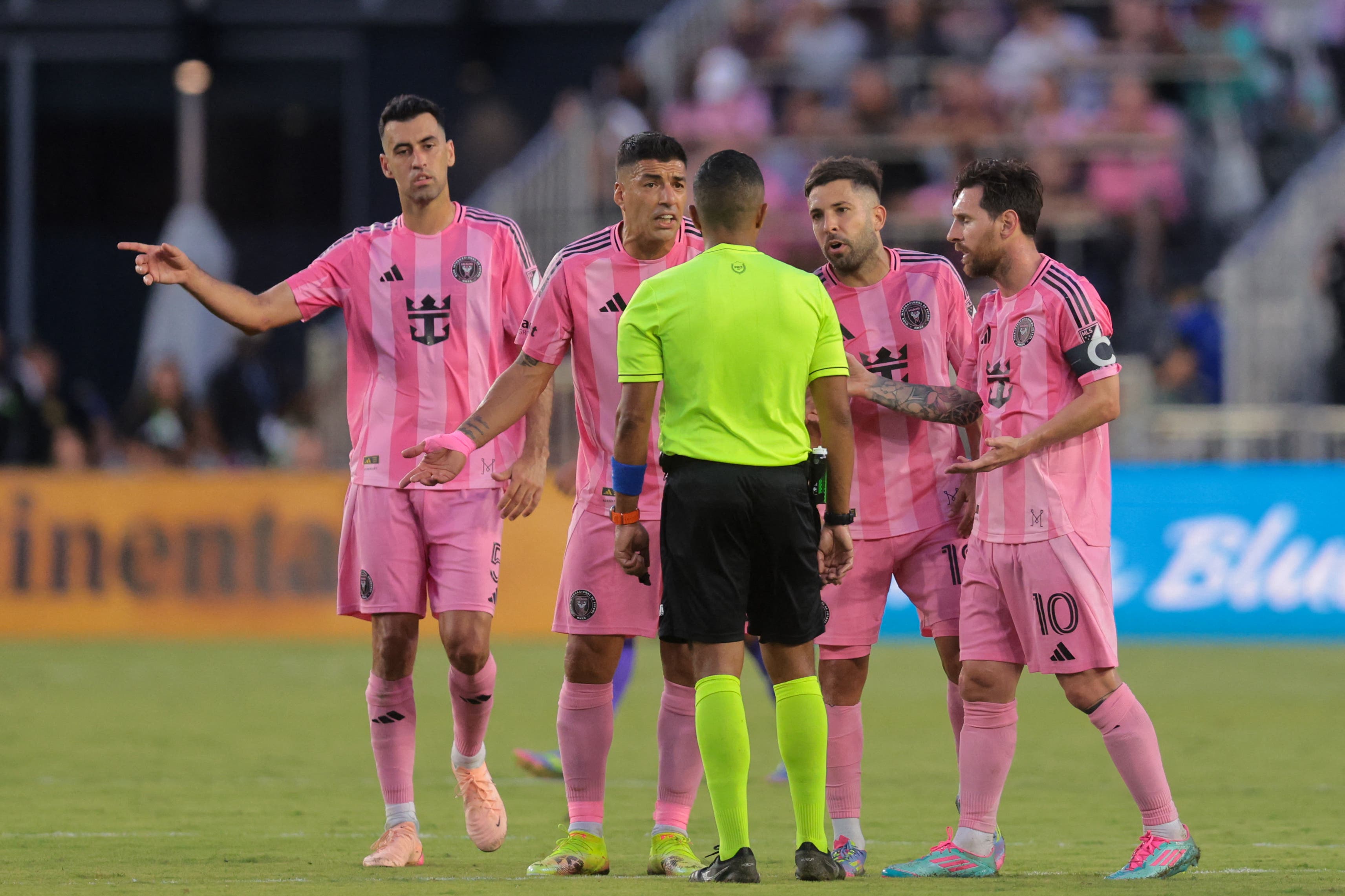 May 18, 2025; Fort Lauderdale, Florida, USA; Inter Miami CF midfielder Sergio Busquets (5), forward Luis Suarez (9), defender Jordi Alba (18) and forward Lionel Messi (10) argue with the referee after a goal by Orlando City during the first half at Chase Stadium. Mandatory Credit: Sam Navarro-Imagn Images