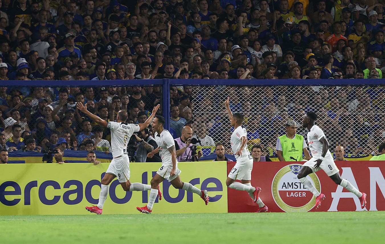 Alianza Lima's Herna Barcos celebrates scoring their first goal with teammates