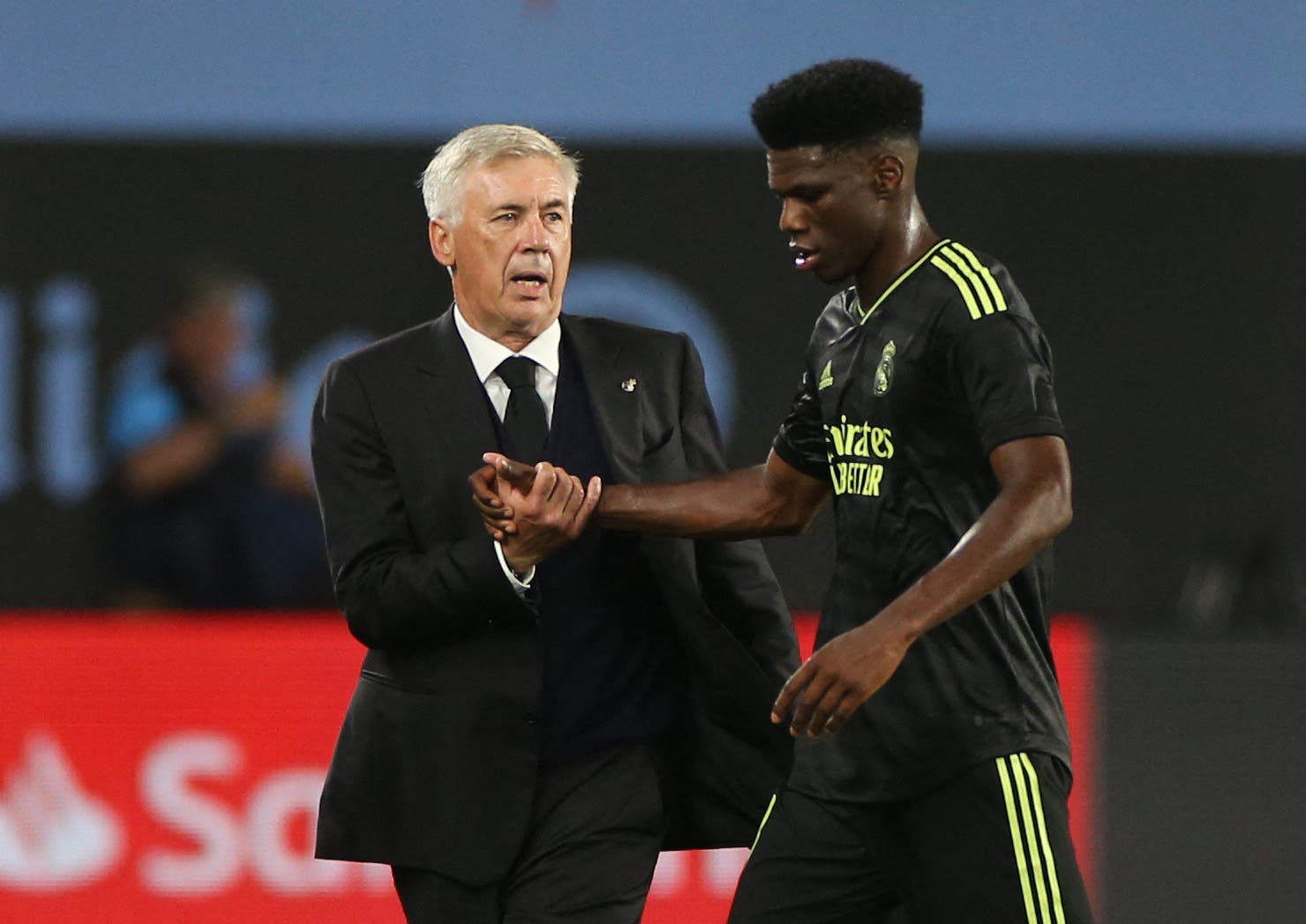 Real Madrid coach Carlo Ancelotti and Aurelien Tchouameni celebrate after the match