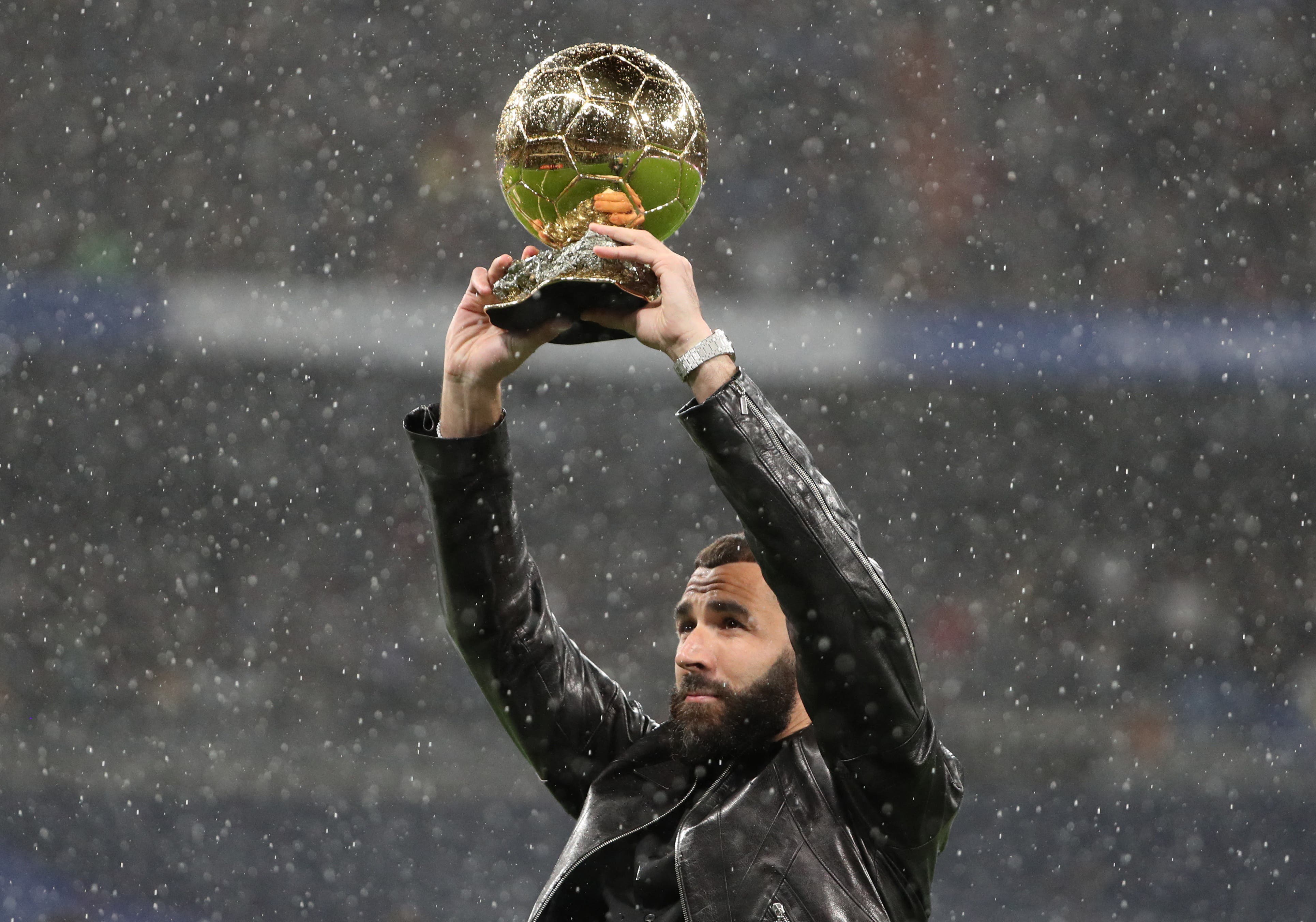 Real Madrid's Karim Benzema poses with the Ballon d'Or trophy 