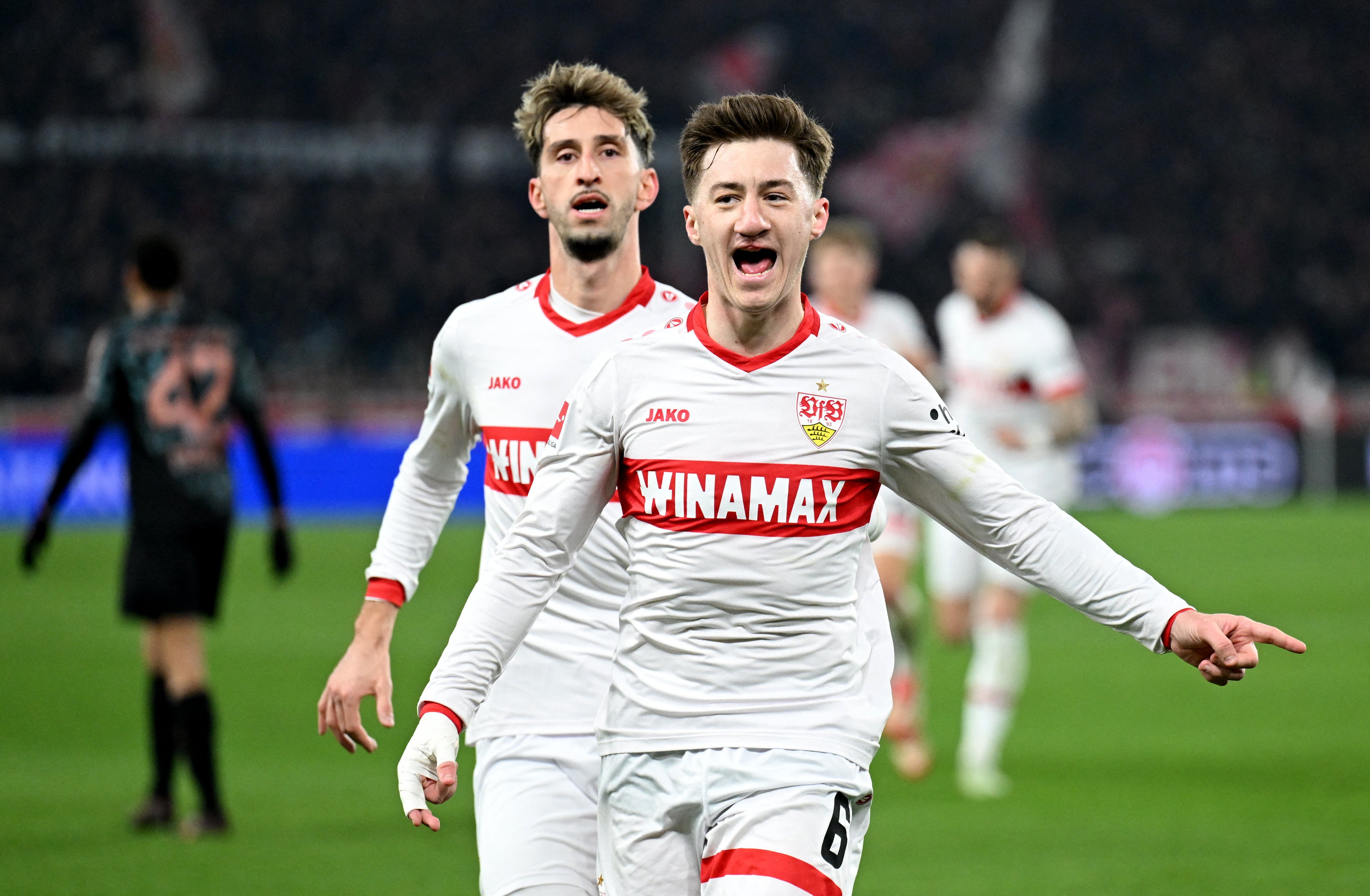 VfB Stuttgart's Angelo Stiller celebrates with VfB Stuttgart's Atakan Karazor after scoring their first goal 