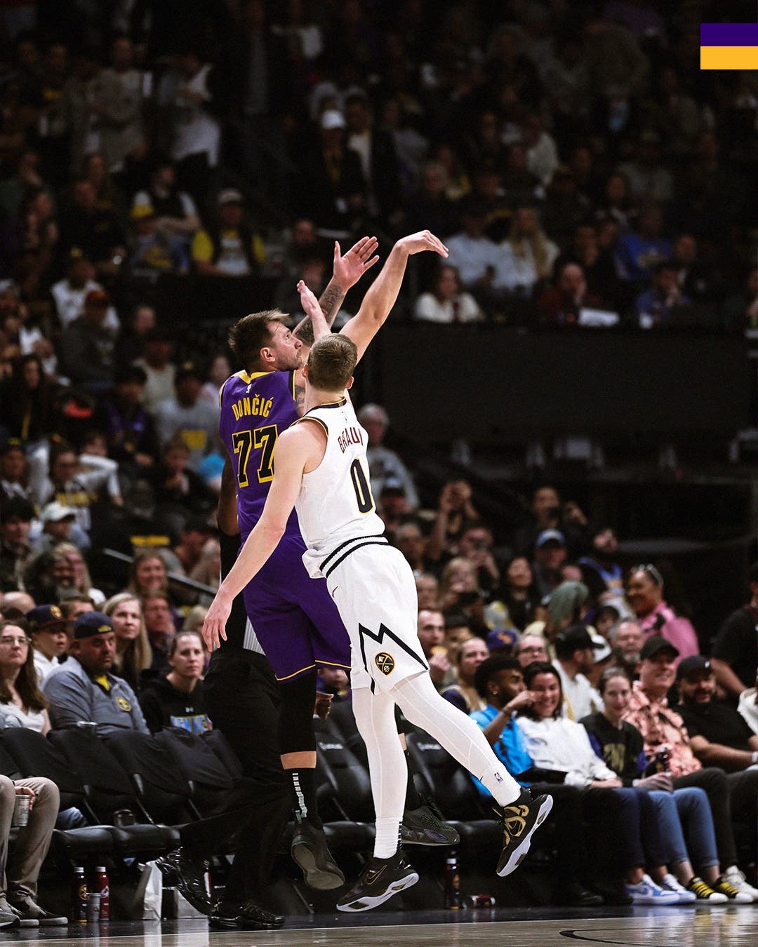 Luka Doncic scoring a three-pointer against Denver Nuggets.