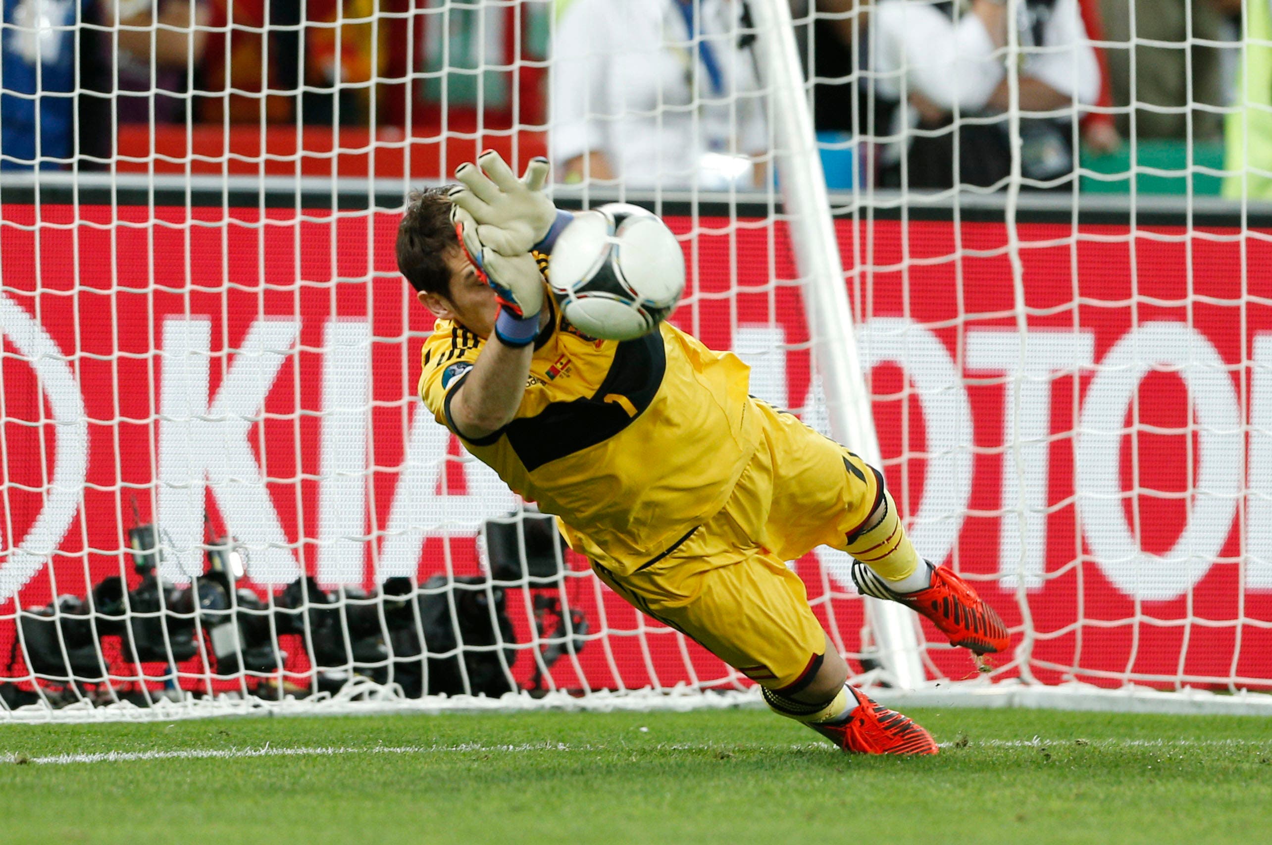 Spain's Iker Casillas saves from Portugal's Joao Moutinho (not pictured) during the penalty shootout