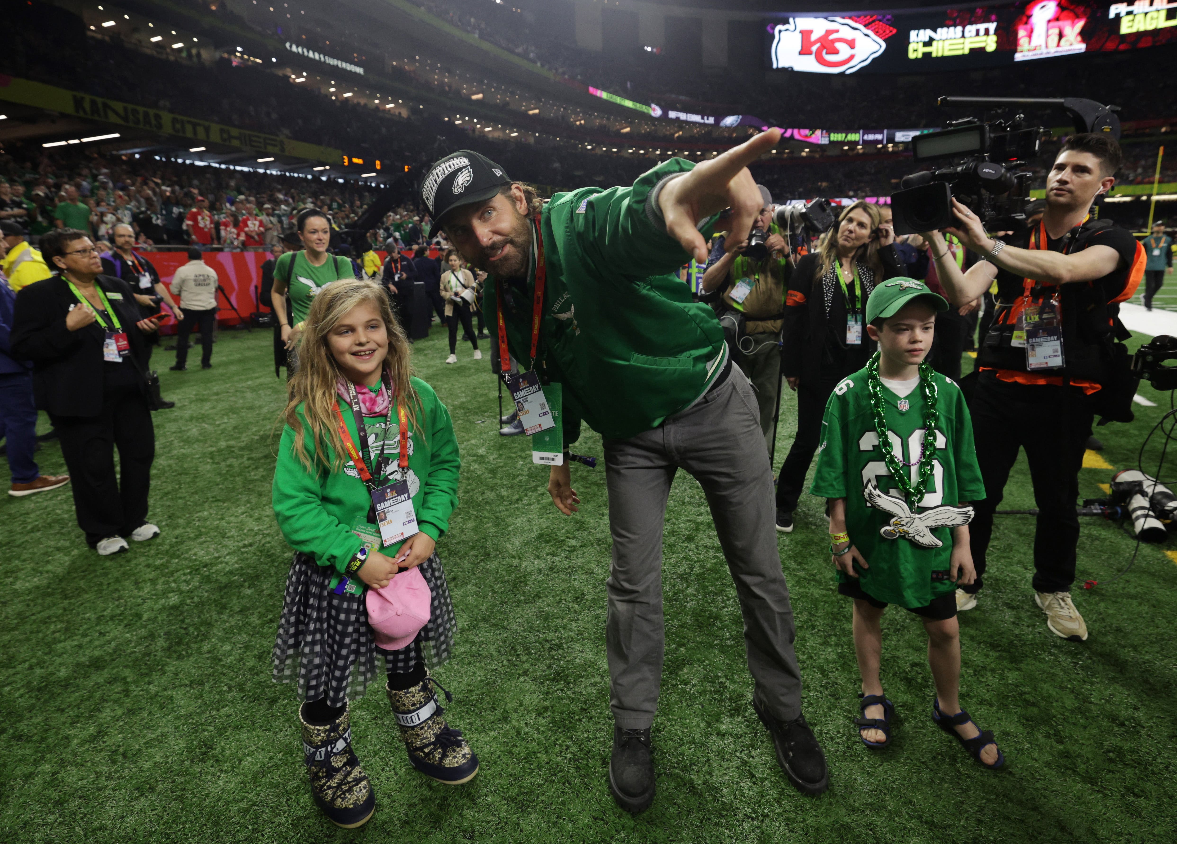 Actor Bradley Cooper and daughter Lea De Seine before the game 