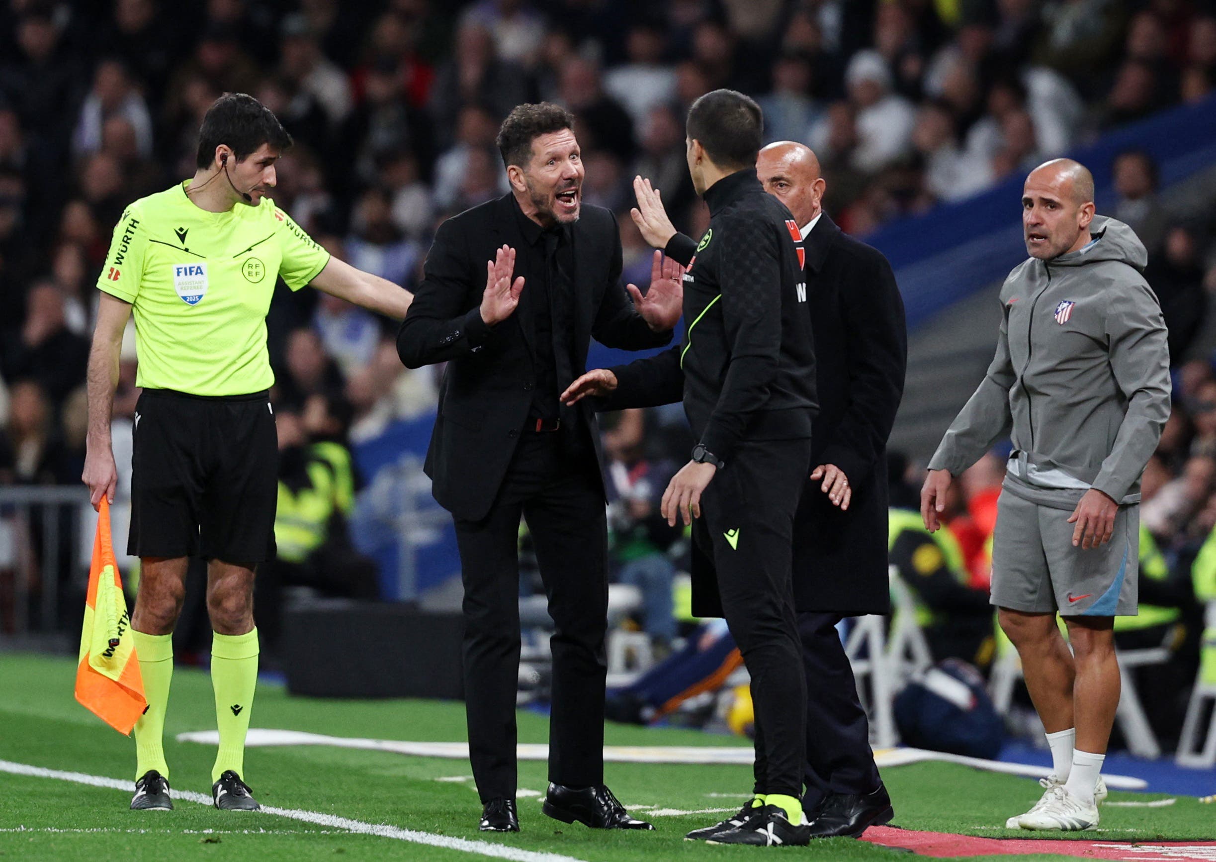 Atletico Madrid coach Diego Simeone reacts after a challenge on Atletico Madrid's Samuel Lino by Real Madrid's Aurelien Tchouameni before they are awarded a penalty following a VAR review 