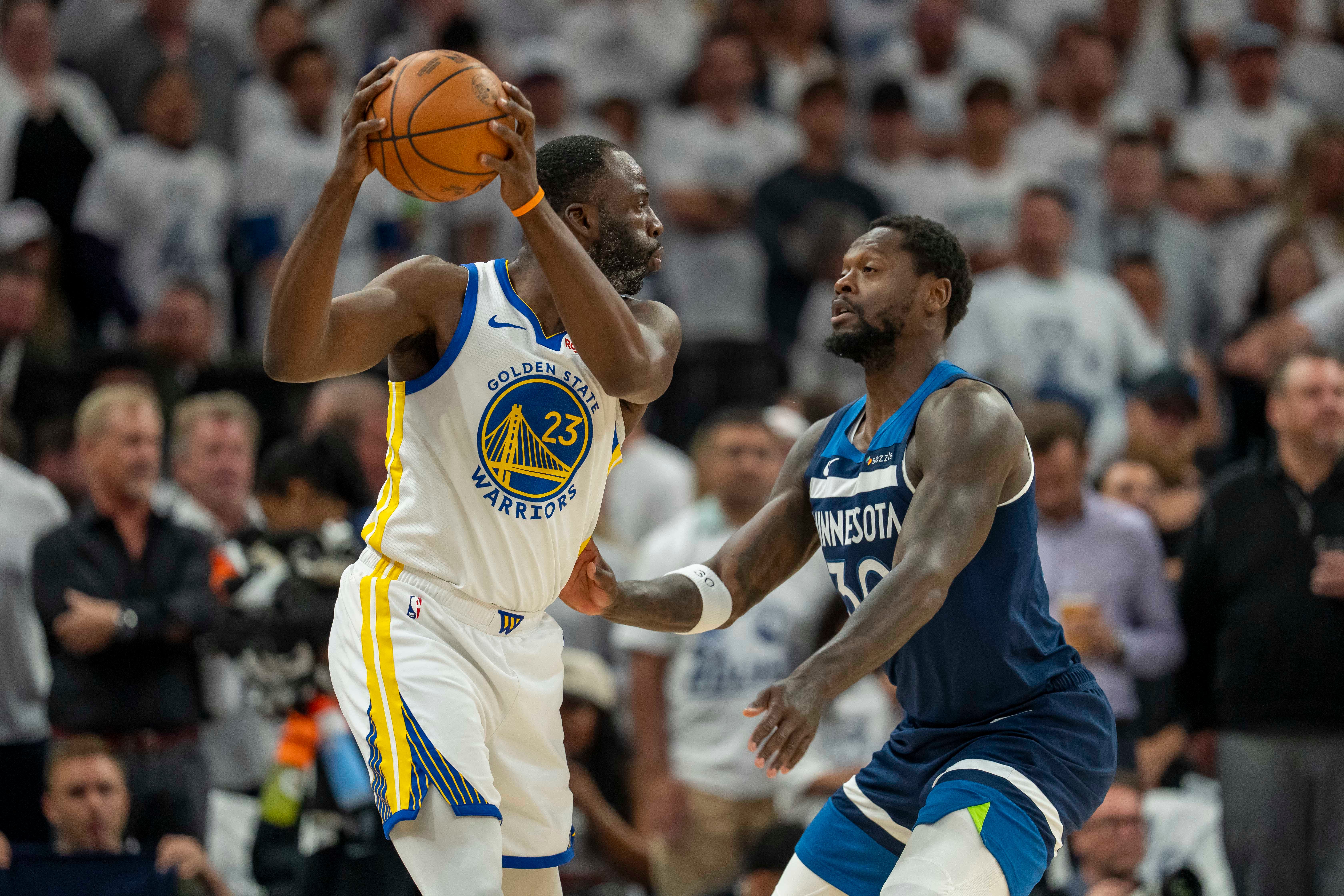 Golden State Warriors' Draymond Green playing against Minnesota Timberwolves' Julius Randle in Game 5.