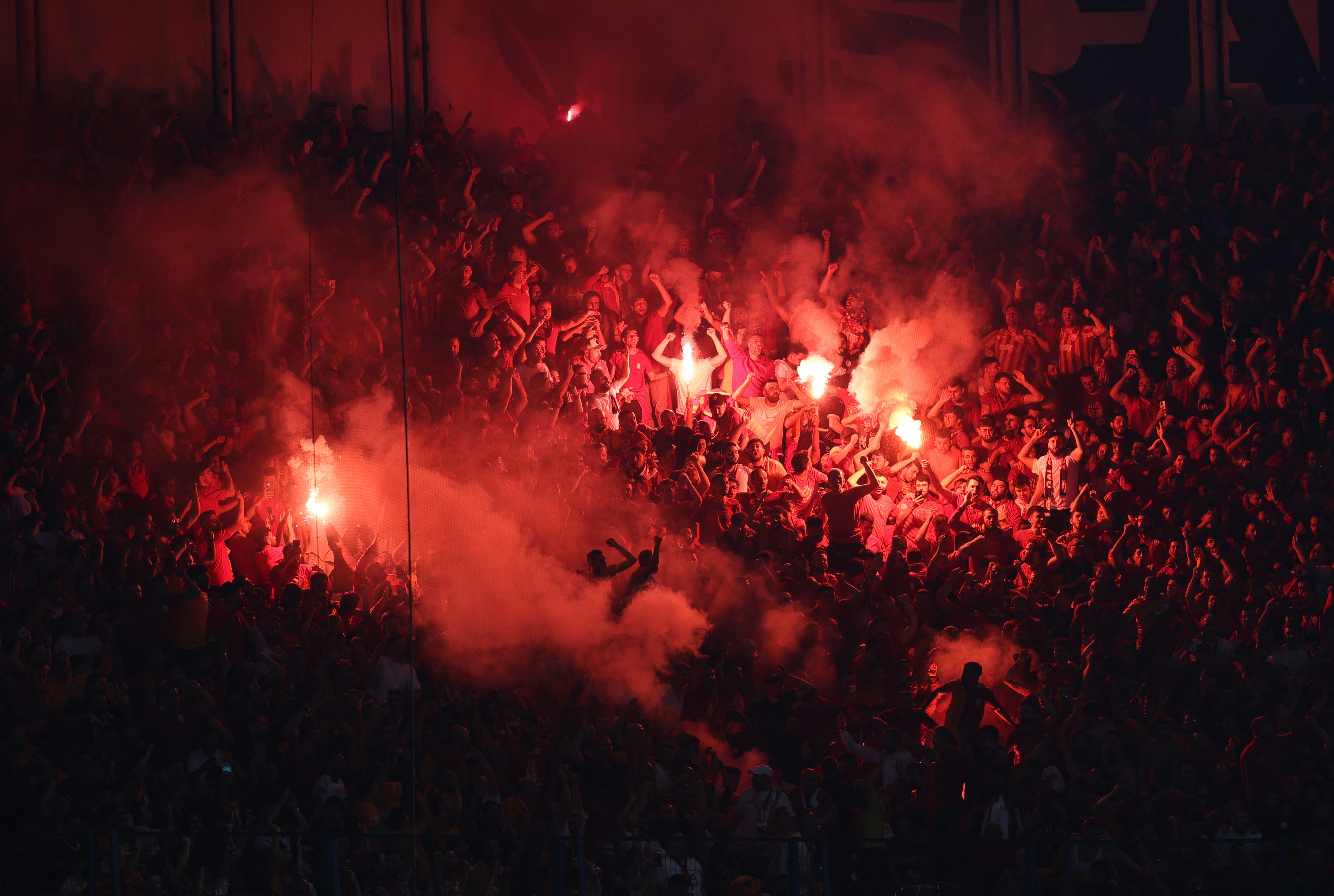  Galatasaray fans set off flares in the stand 