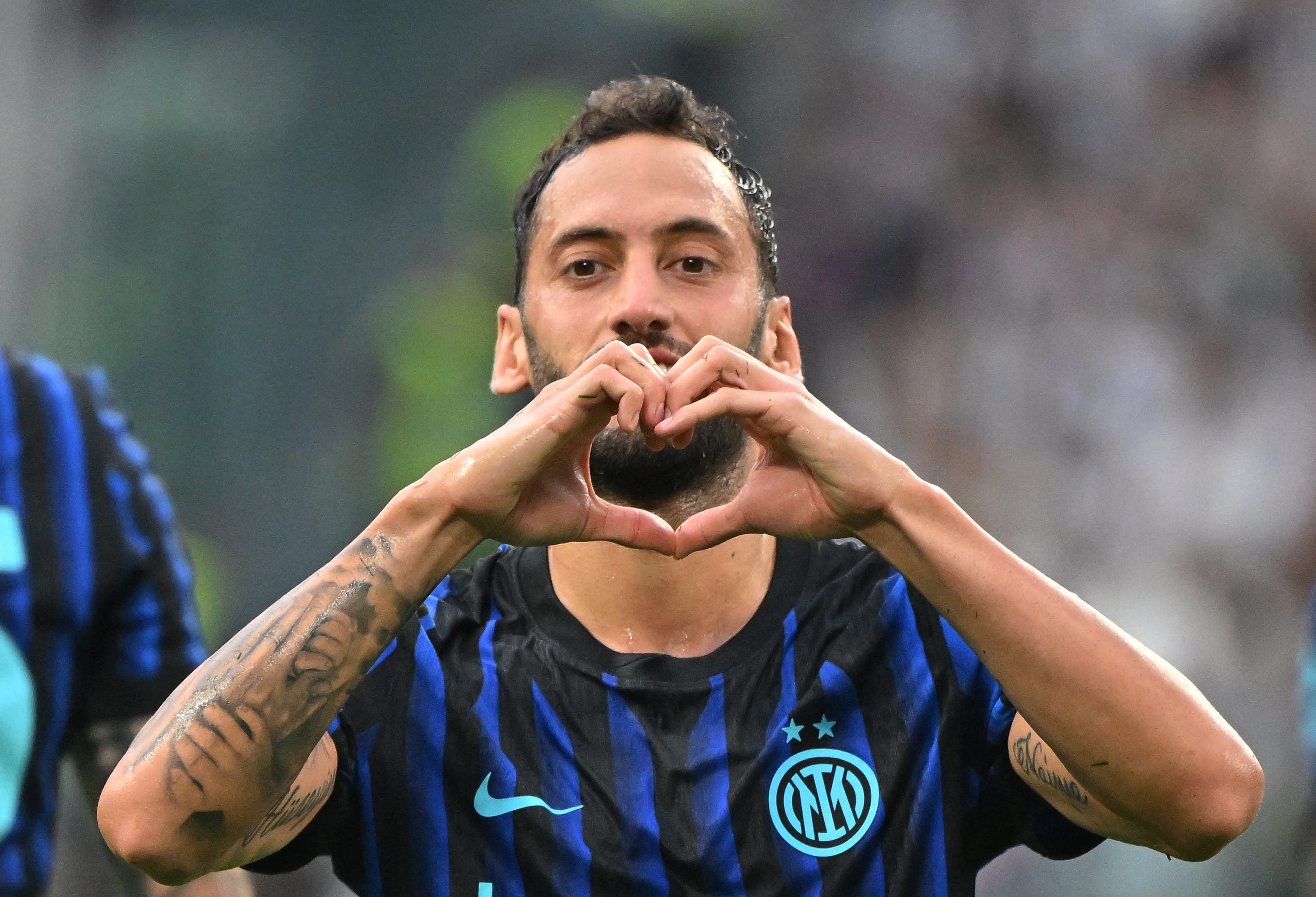Soccer Football - Serie A - Juventus v Inter Milan - Allianz Stadium, Turin, Italy - September 13, 2025 Inter Milan's Hakan Calhanoglu celebrates scoring their first goal REUTERS/Alberto Lingria