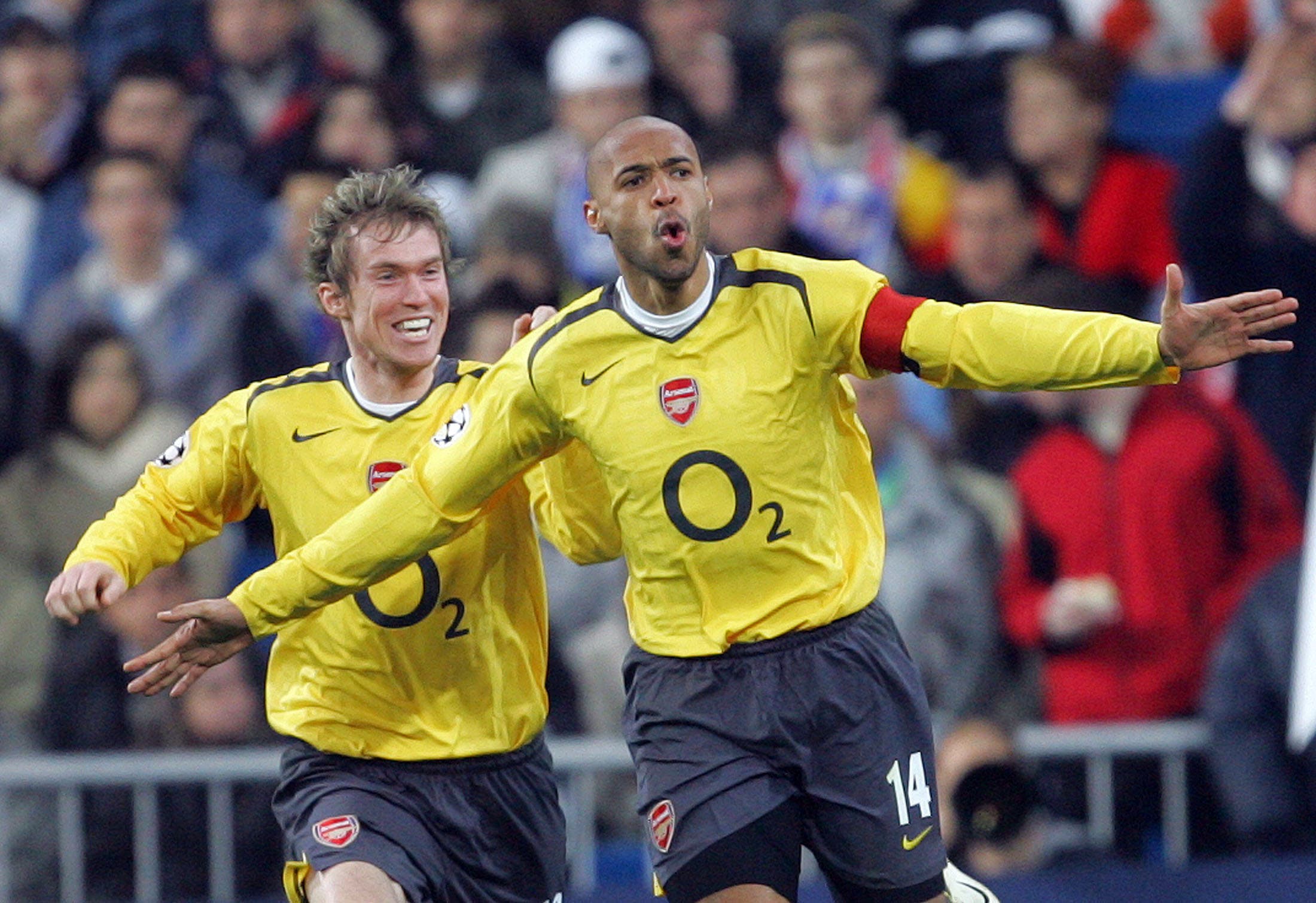 Arsenal's Thierry Henry (R) of France celebrates his goal against Real Madrid with his team mate Alexander Hleb during their Champions League first knockout round first leg soccer match at Madrid's Santiago Bernabeu stadium