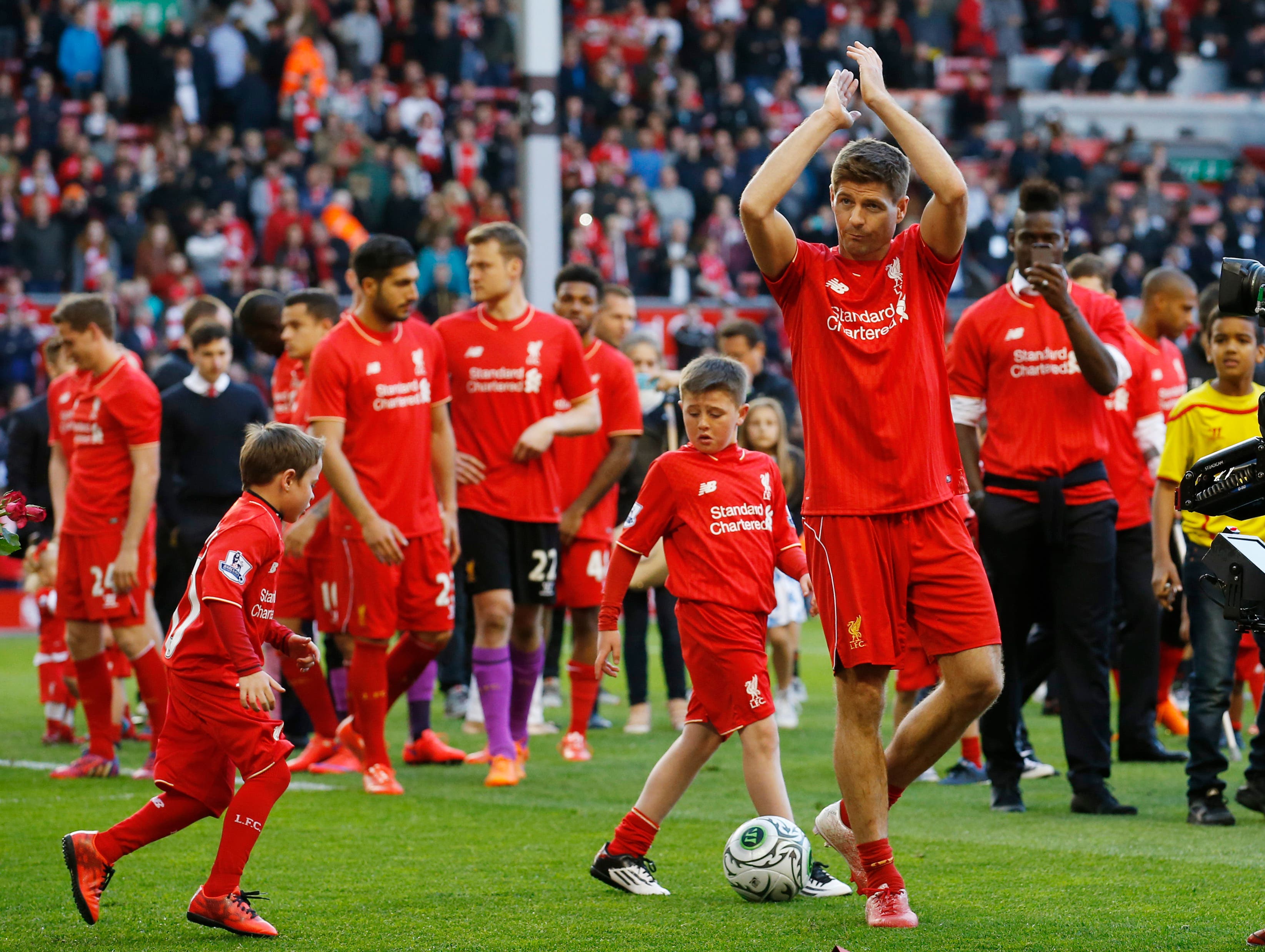 Liverpool's Steven Gerrard acknowledges the crowd as he walks on the pitch after his final game at Anfield