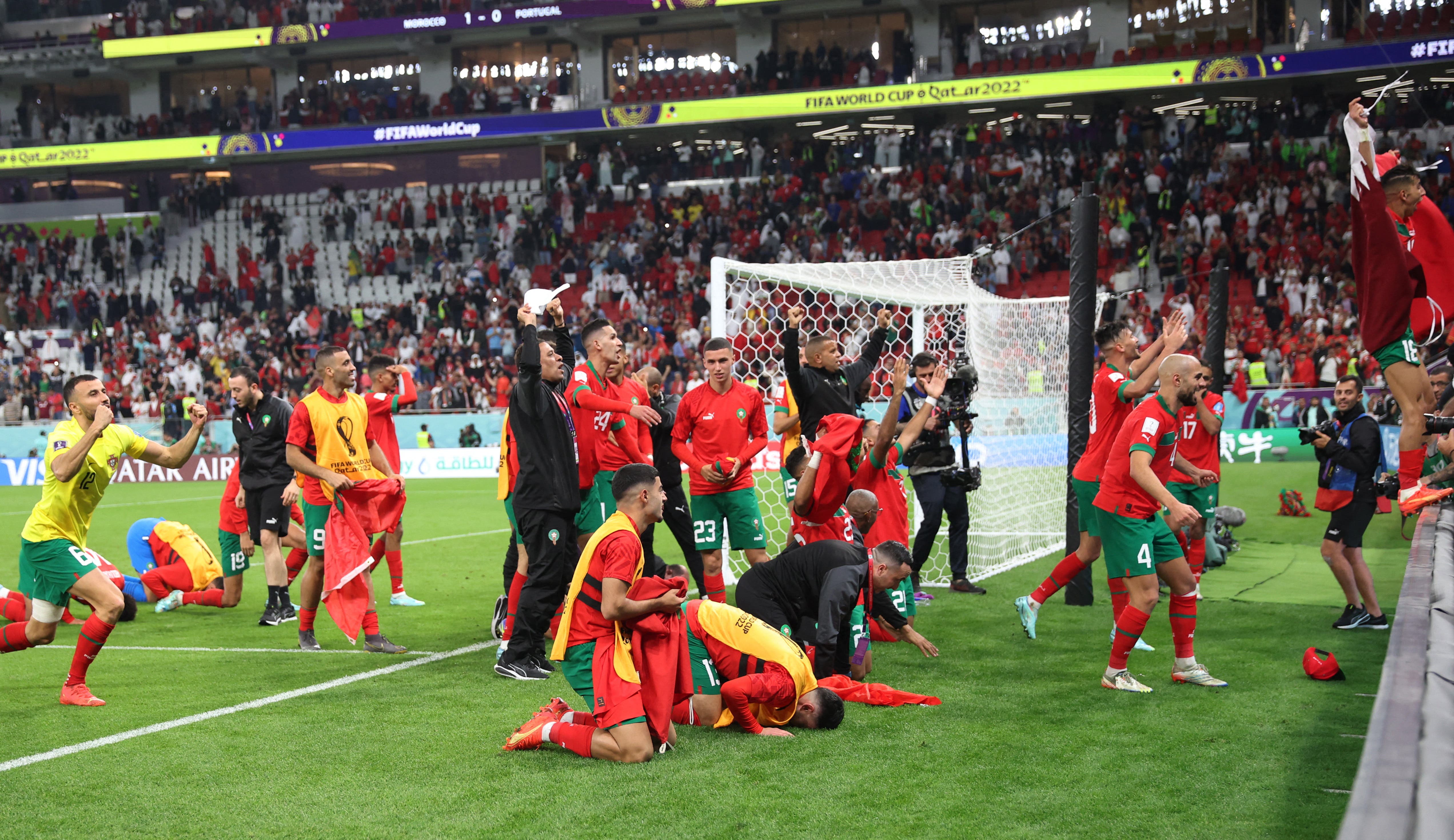 Soccer Football - FIFA World Cup Qatar 2022 - Quarter Final - Morocco v Portugal - Al Thumama Stadium, Doha, Qatar - December 10, 2022 Morocco players celebrate with fans after the match as Morocco progress to the semi finals REUTERS/Carl Recine