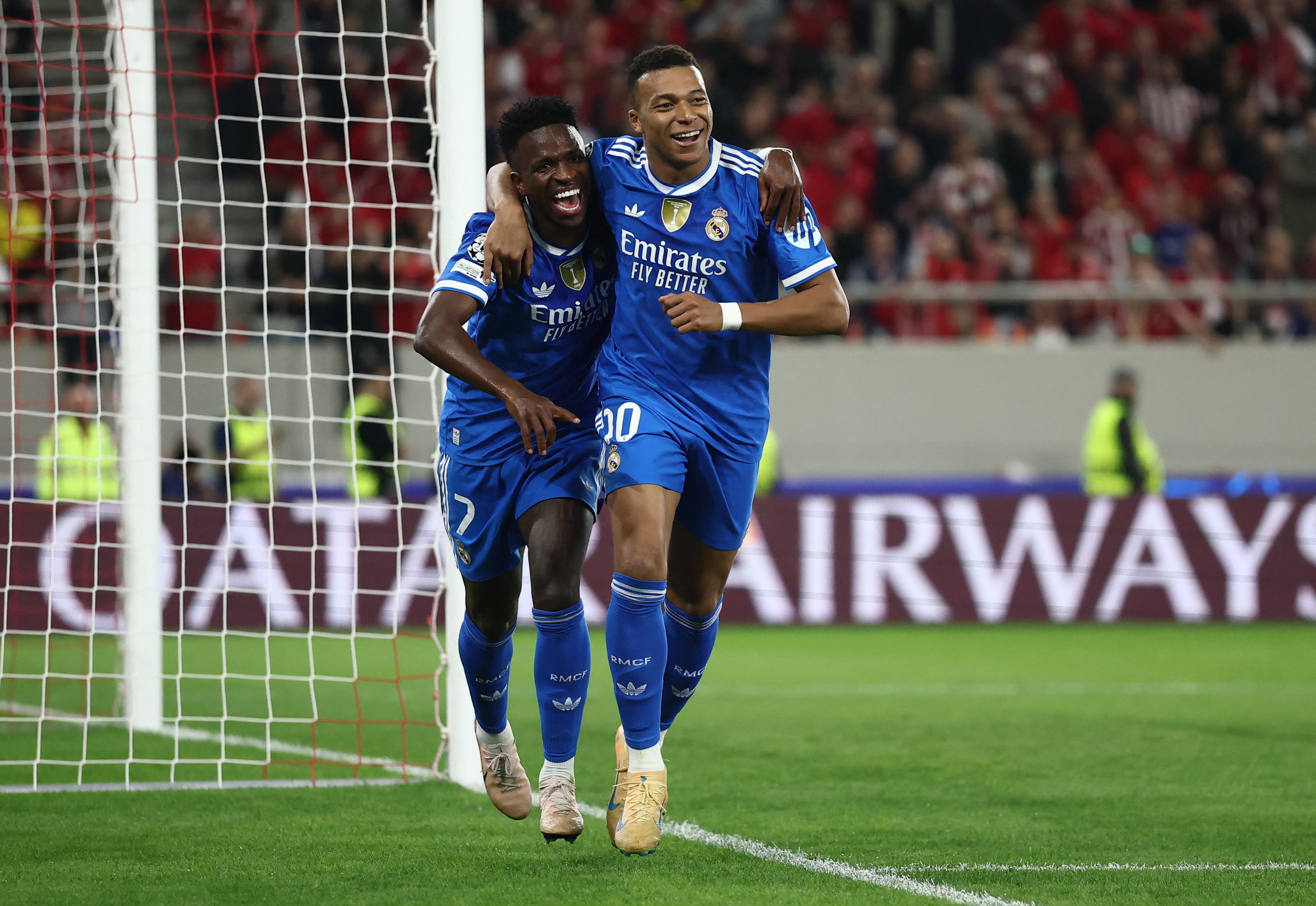 Soccer Football - UEFA Champions League - Olympiacos v Real Madrid - Georgios Karaiskakis Stadium, Piraeus, Greece - November 26, 2025 Real Madrid's Kylian Mbappe celebrates scoring their fourth goal with Vinicius Junior REUTERS/Stephane Mahe